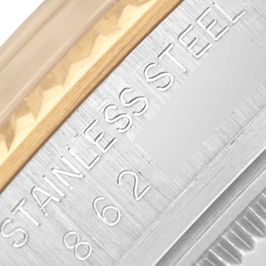 The image shows a close-up of the side engraving on a Rolex Datejust 16013 Men's Steel and Gold (two tone) Silver Dial 16013 Men's Steel and Gold (two tone) Silver Dial, highlighting "STAINLESS STEEL" text and part of the bezel.