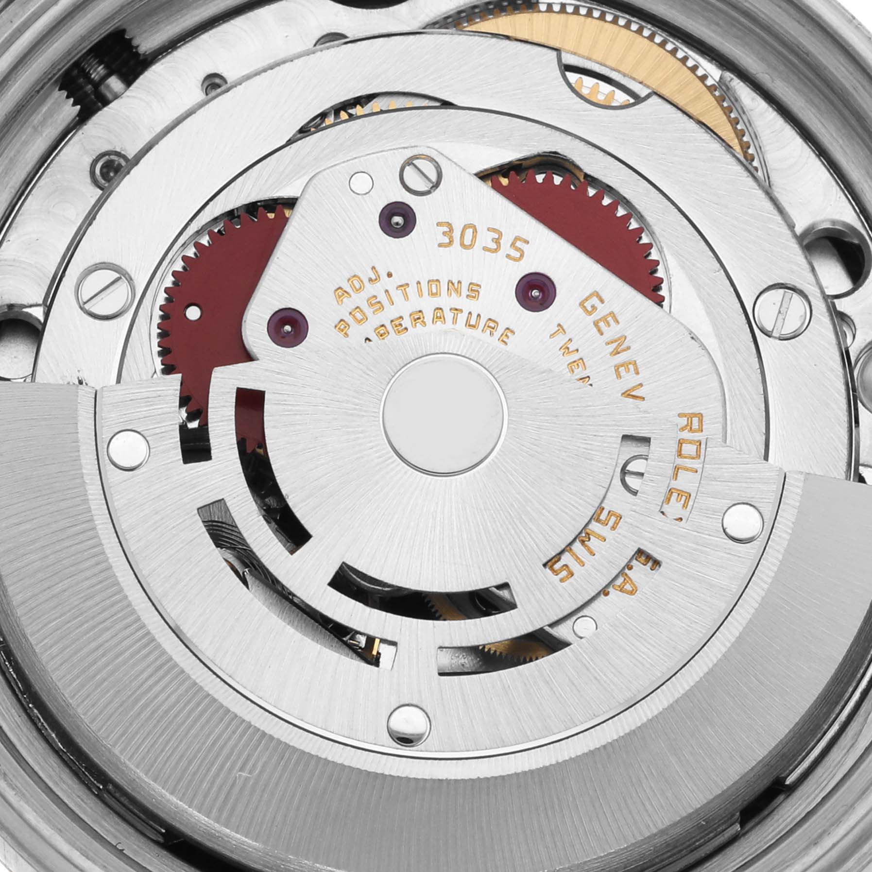 This image shows the movement of a Rolex Datejust 16013 Men's Steel and Gold (two tone) Silver Dial 16013 Men's Steel and Gold (two tone) Silver Dial, focusing on its intricate mechanics and components at a top-down angle.