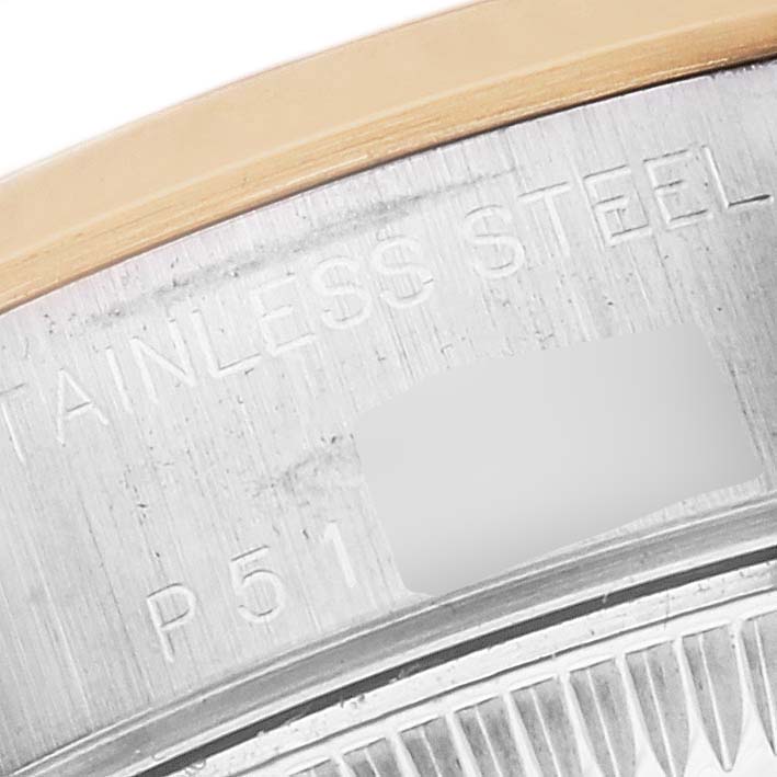 This is a close-up of the case back rim of a Rolex Datejust 79163 Women's Steel and Gold (two tone) Champagne Dial 79163 Women's Steel and Gold (two tone) Champagne Dial, showing part of the stainless steel text and model code.