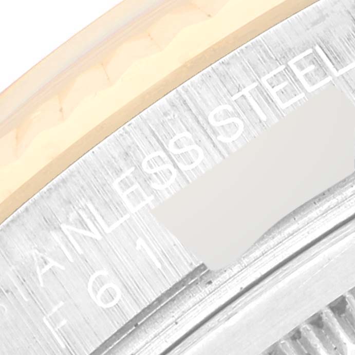 The image shows a close-up of the stainless steel case back and partially the bezel of a Rolex Datejust 116233 Men's Steel and Gold (two tone) Champagne Dial 116233 Men's Steel and Gold (two tone) Champagne Dial watch.