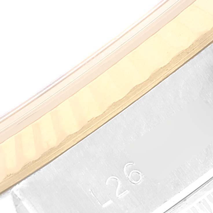 This close-up image shows the bezel and serial number area of a Rolex Datejust 69173 Women's Steel and Gold (two tone) White Dial 69173 Women's Steel and Gold (two tone) White Dial watch.