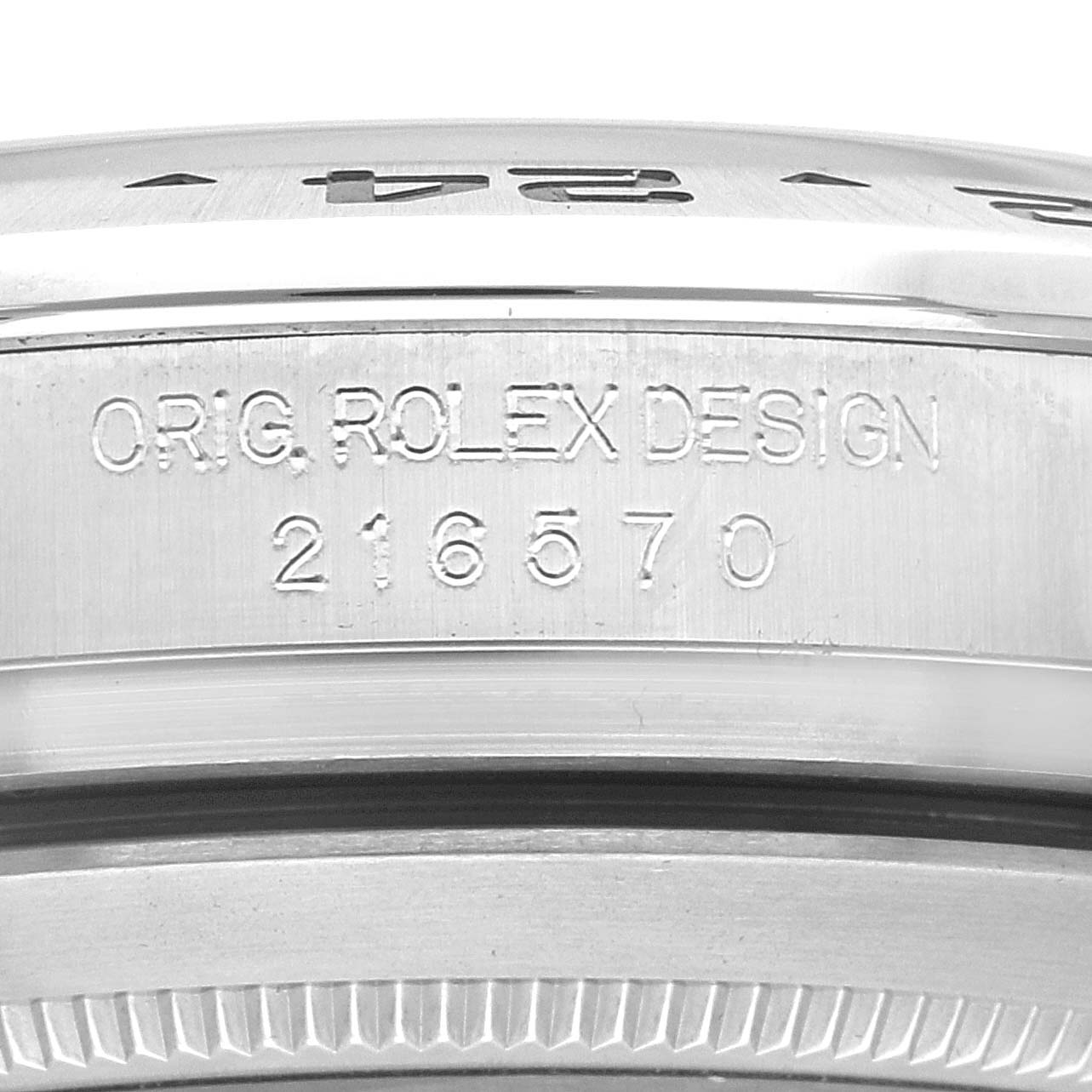 This image shows a close-up of the side of the bezel and case of a Rolex Explorer 216570 Men
s Stainless Steel White Dial 216570 Men
s Stainless Steel White Dial watch, featuring the design and model number 216570.