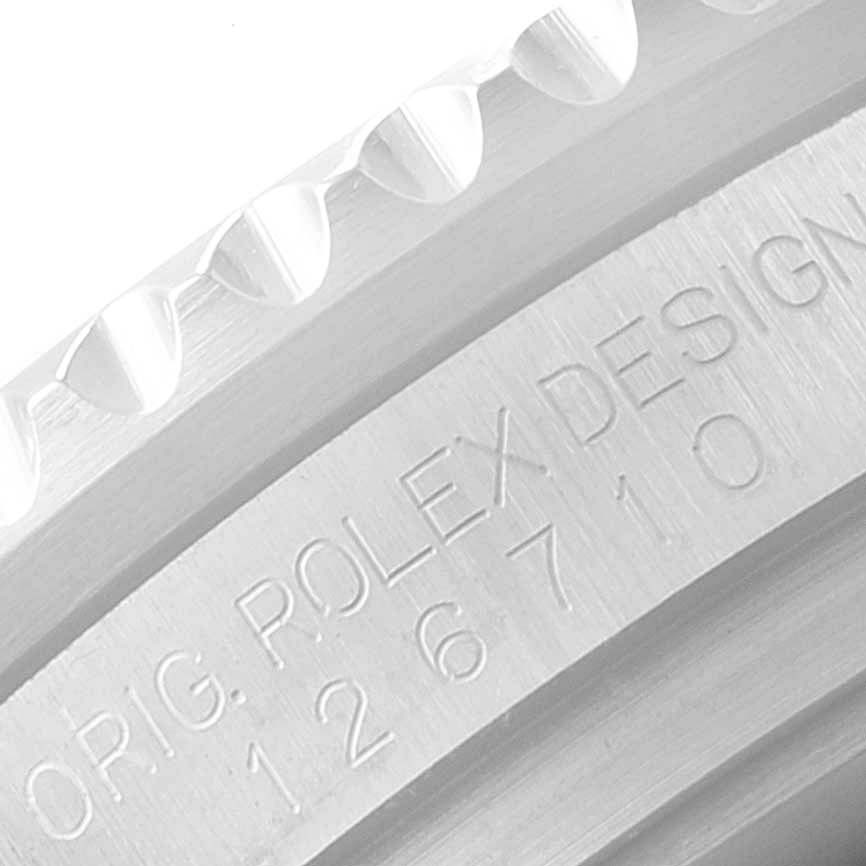 This image shows a close-up of the bezel and engraving on the side of the Rolex GMT-Master 126710 Men
s Stainless Steel Black Dial 126710 Men
s Stainless Steel Black Dial watch case.