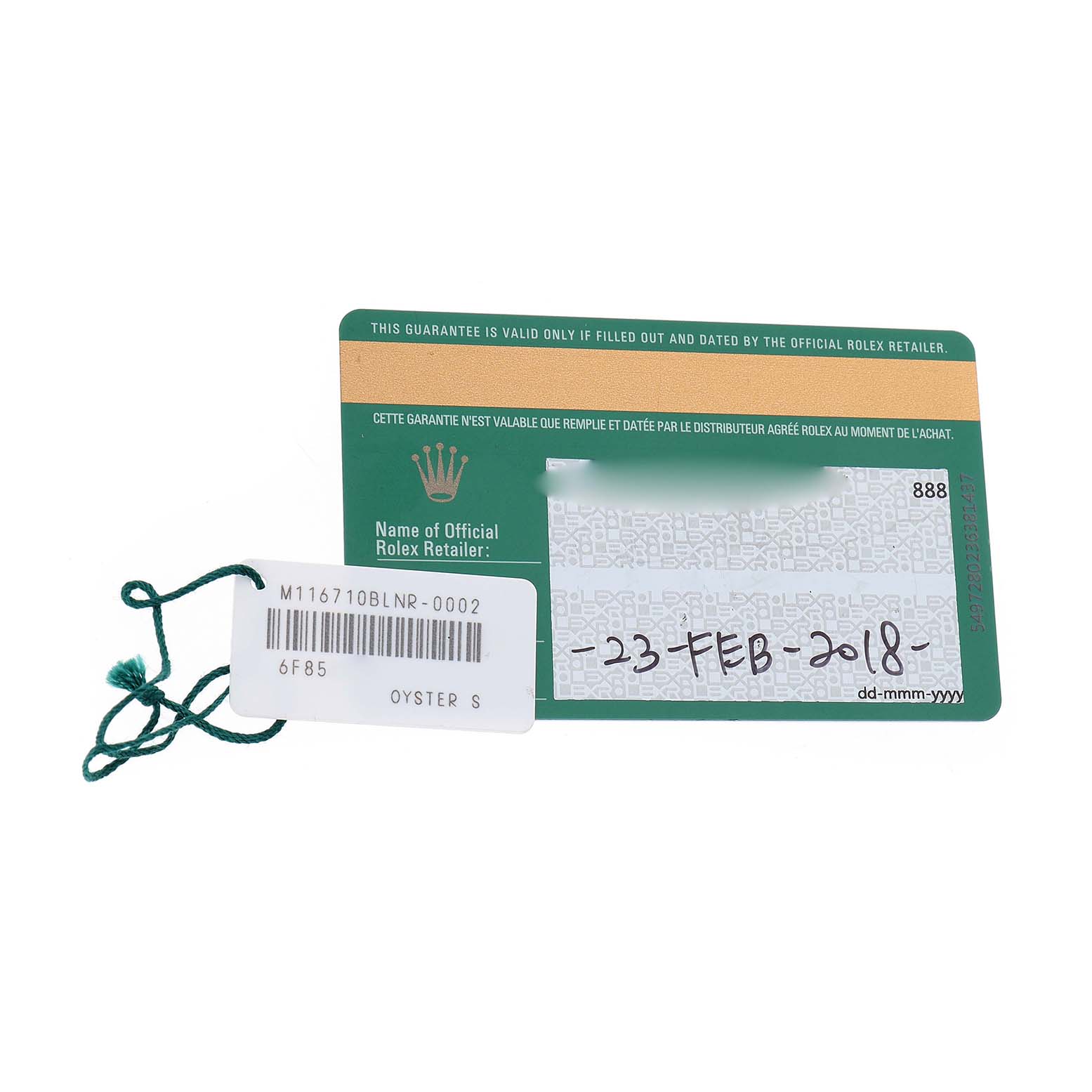 The image shows a Rolex GMT-Master 116710 Men's Stainless Steel Black Dial's warranty card with a string tag, placed flat.