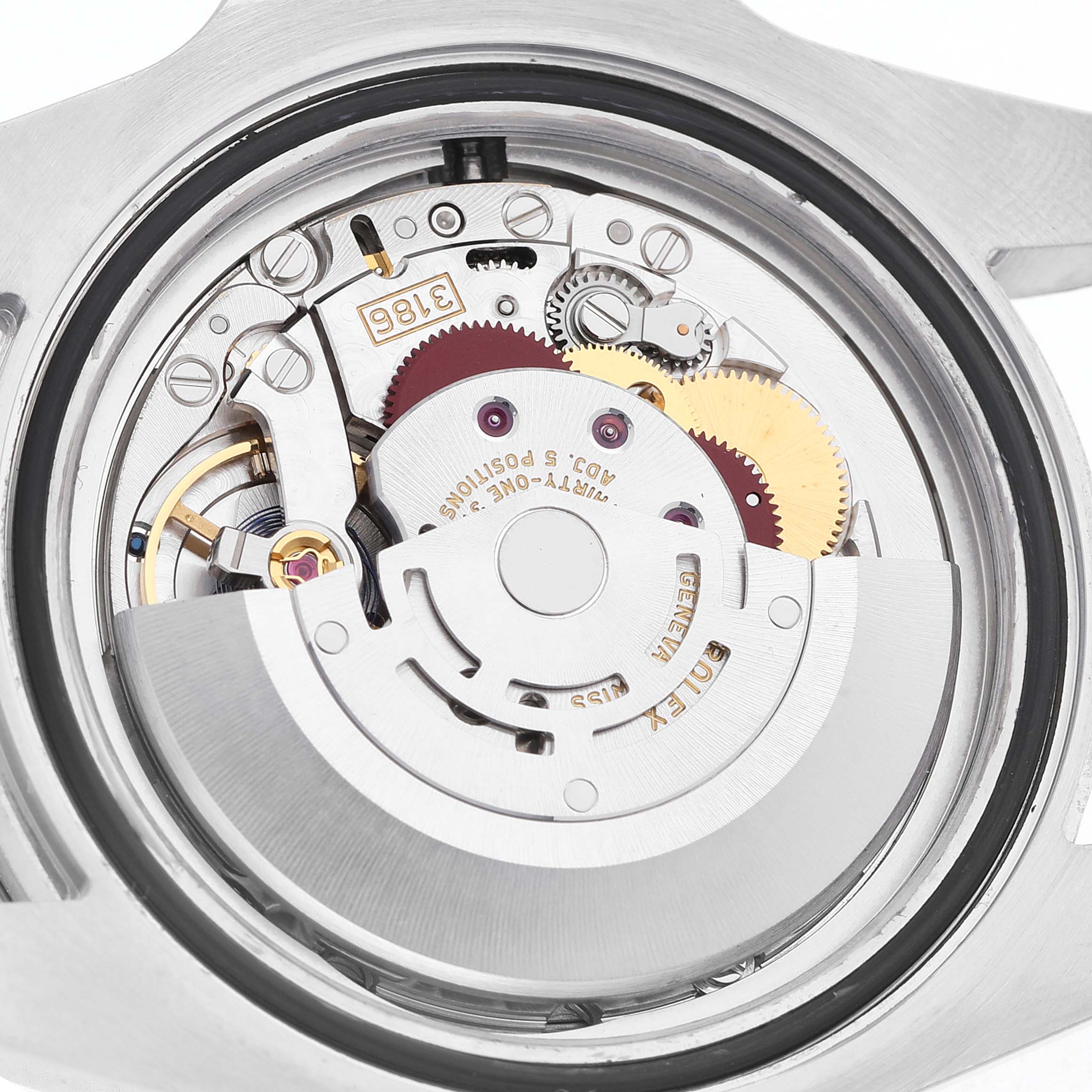 The image shows the movement of the Rolex GMT-Master 116710 Men's Stainless Steel Black Dial from the back, revealing gears and components.