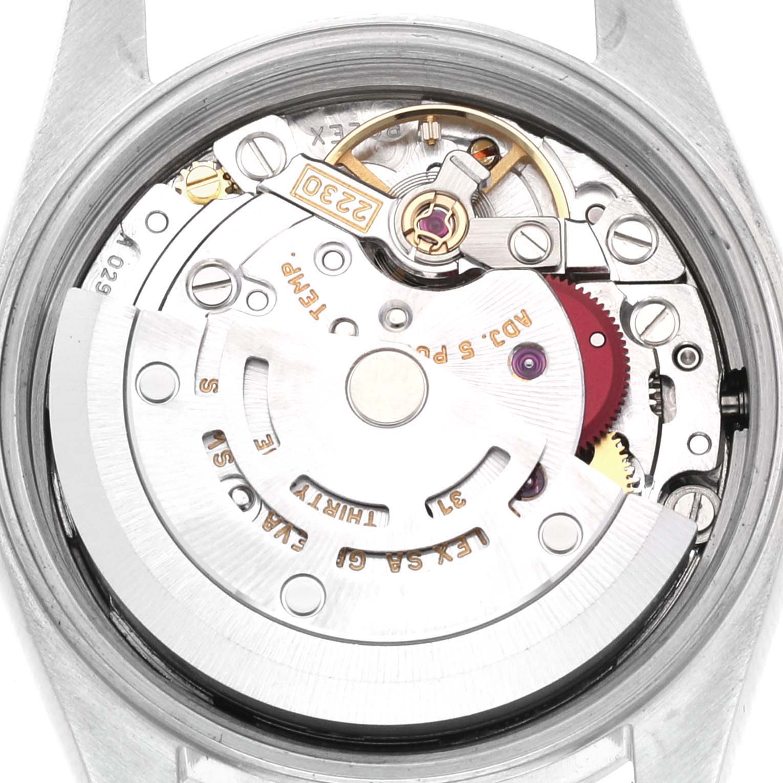 This image shows a close-up view of the internal mechanism and movement of the Rolex Oyster Perpetual 76094 Women's Stainless Steel Blue Dial 76094 Women's Stainless Steel Blue Dial watch.