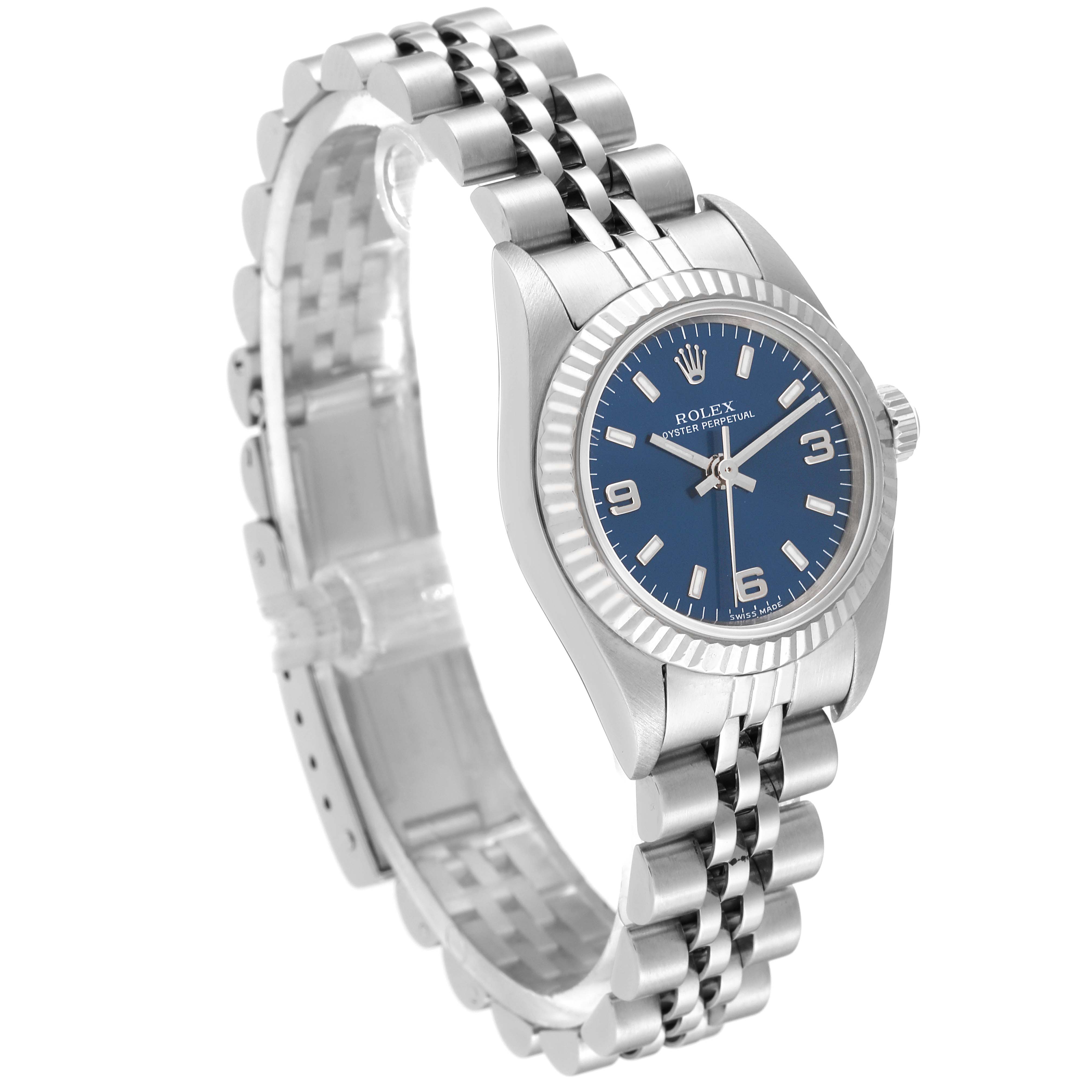 The Rolex Oyster Perpetual 76094 Women's Stainless Steel Blue Dial 76094 Women's Stainless Steel Blue Dial watch is displayed at a slight angle, showing the face, bezel, crown, and bracelet.