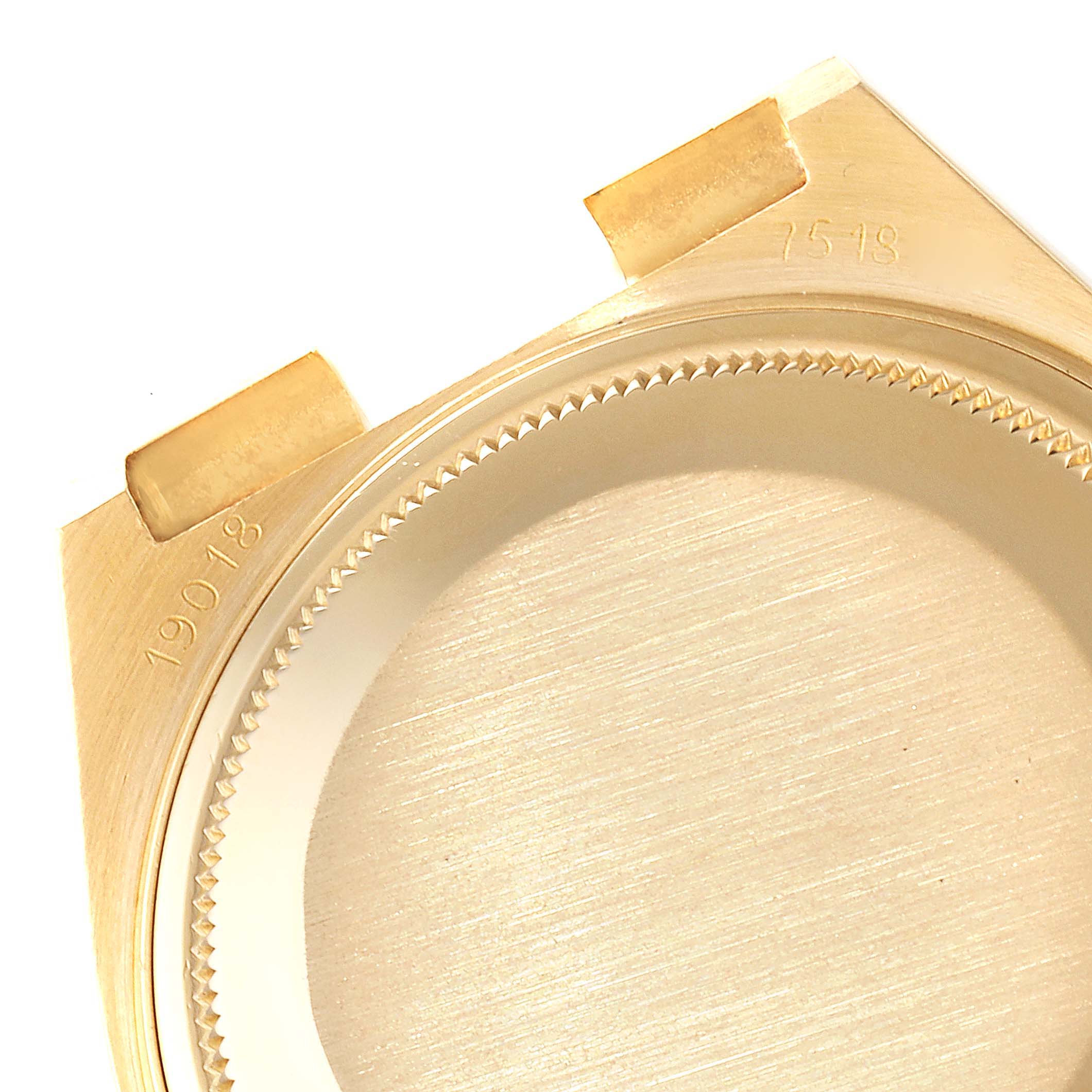 The image shows a close-up of the caseback and the inner part of the bezel of a Rolex President 19018 Men
s Yellow Gold Champagne Dial 19018 Men
s Yellow Gold Champagne Dial model watch.