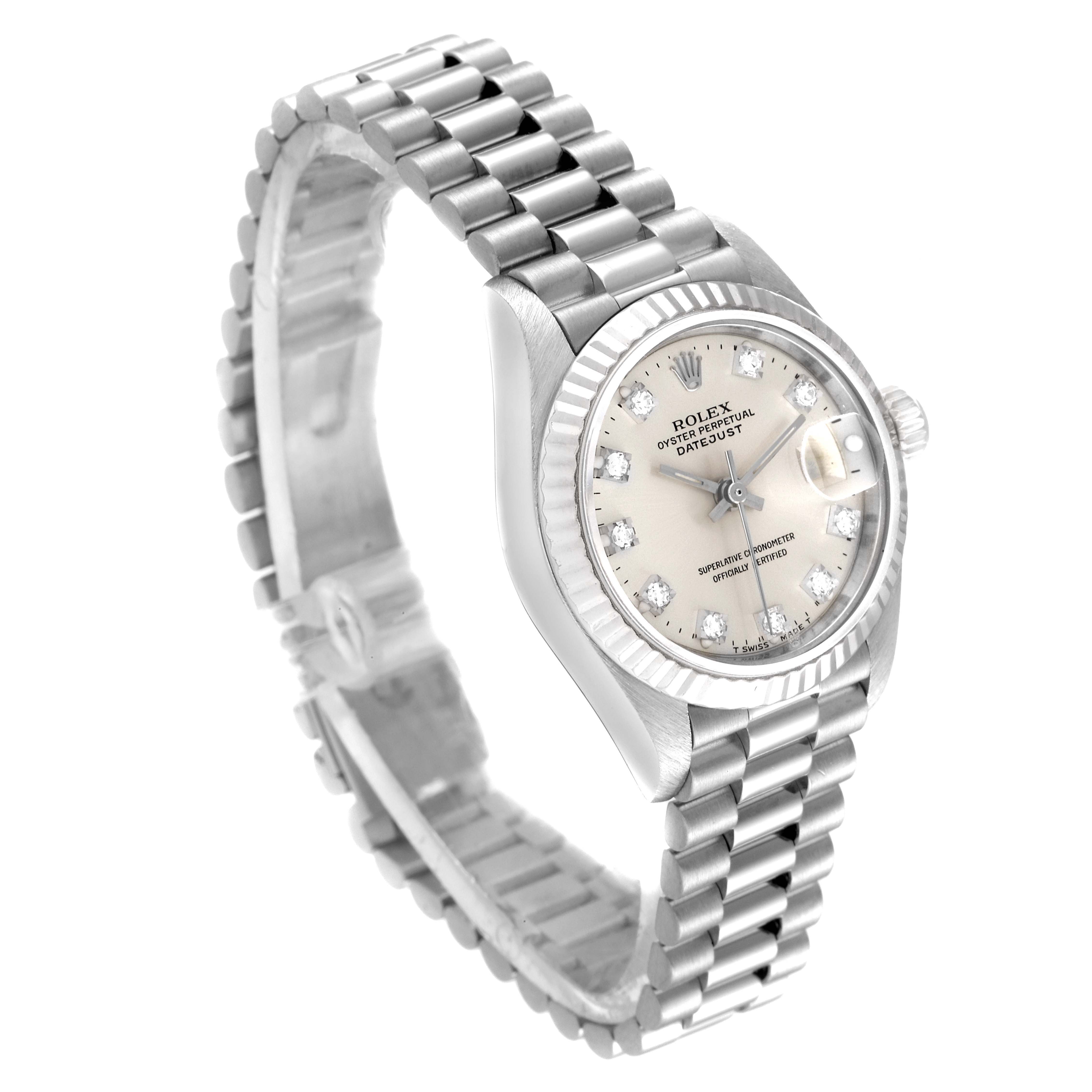 This image shows a Rolex President 69179 Women
s White Gold Silver Dial 69179 Women
s White Gold Silver Dial model watch at an angled view, highlighting its face, bezel, and bracelet.
