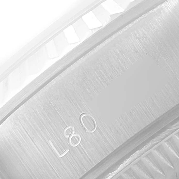 A close-up of the engraving inside the bezel and case of a Rolex President 69179 Women
s White Gold Silver Dial 69179 Women
s White Gold Silver Dial model watch.