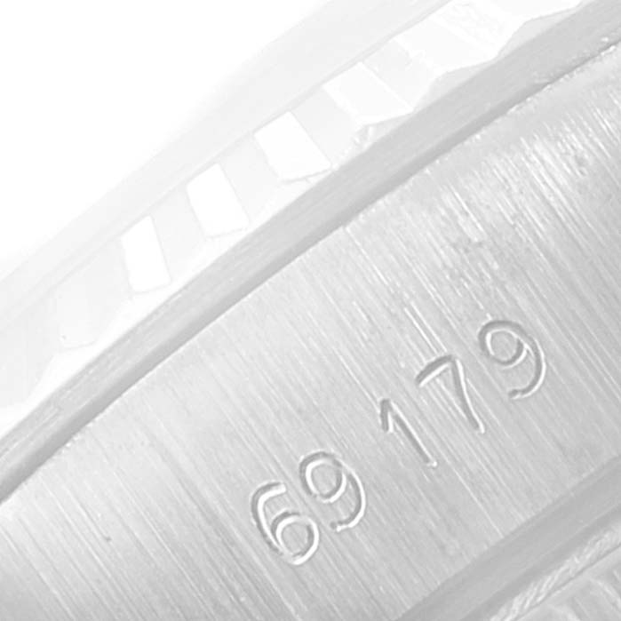 The close-up image shows the engraved serial number and part of the bezel of the Rolex President 69179 Women
s White Gold Silver Dial 69179 Women
s White Gold Silver Dial model watch.