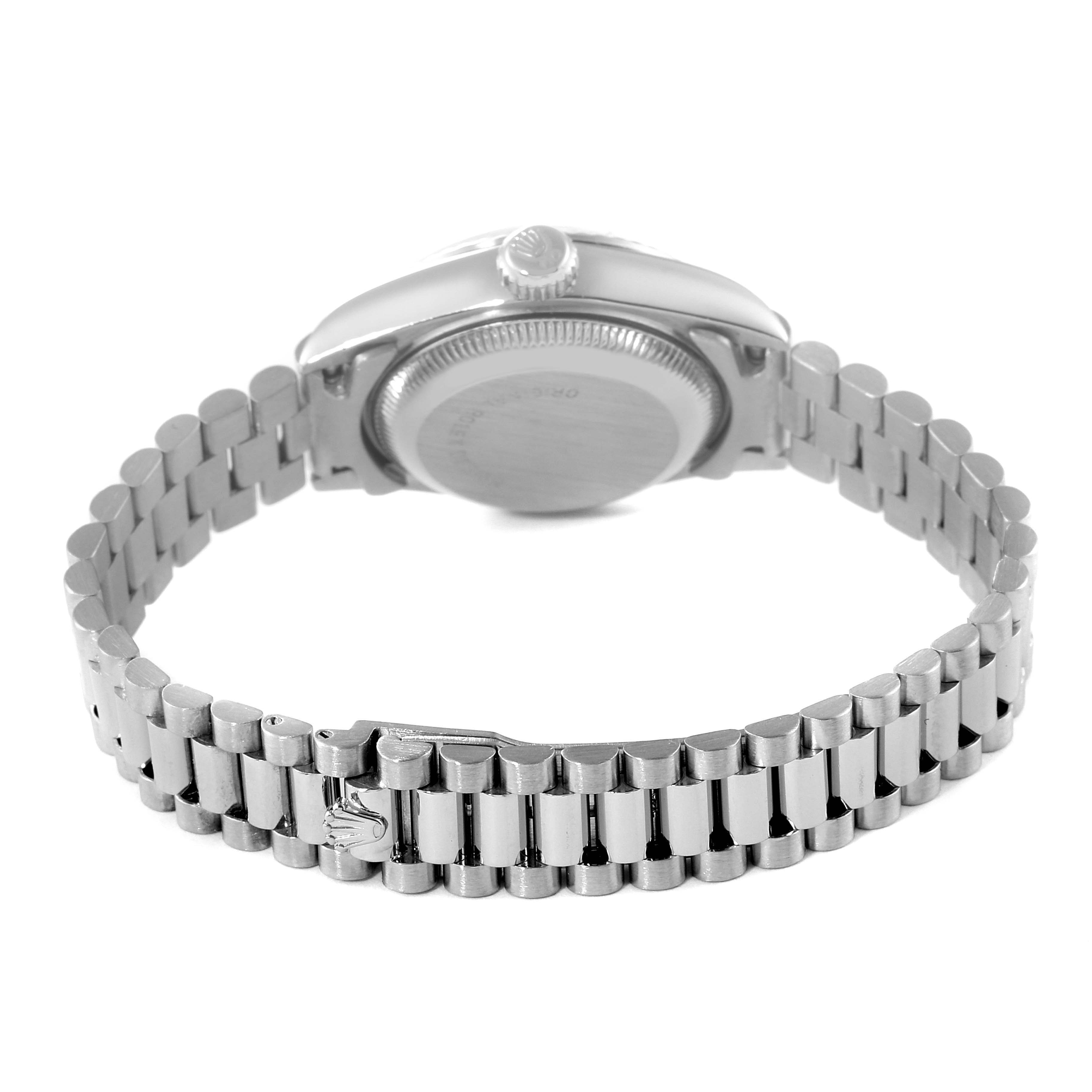 The image shows the back casing and bracelet of a Rolex President 69179 Women
s White Gold Silver Dial 69179 Women
s White Gold Silver Dial model watch from a rear angle.