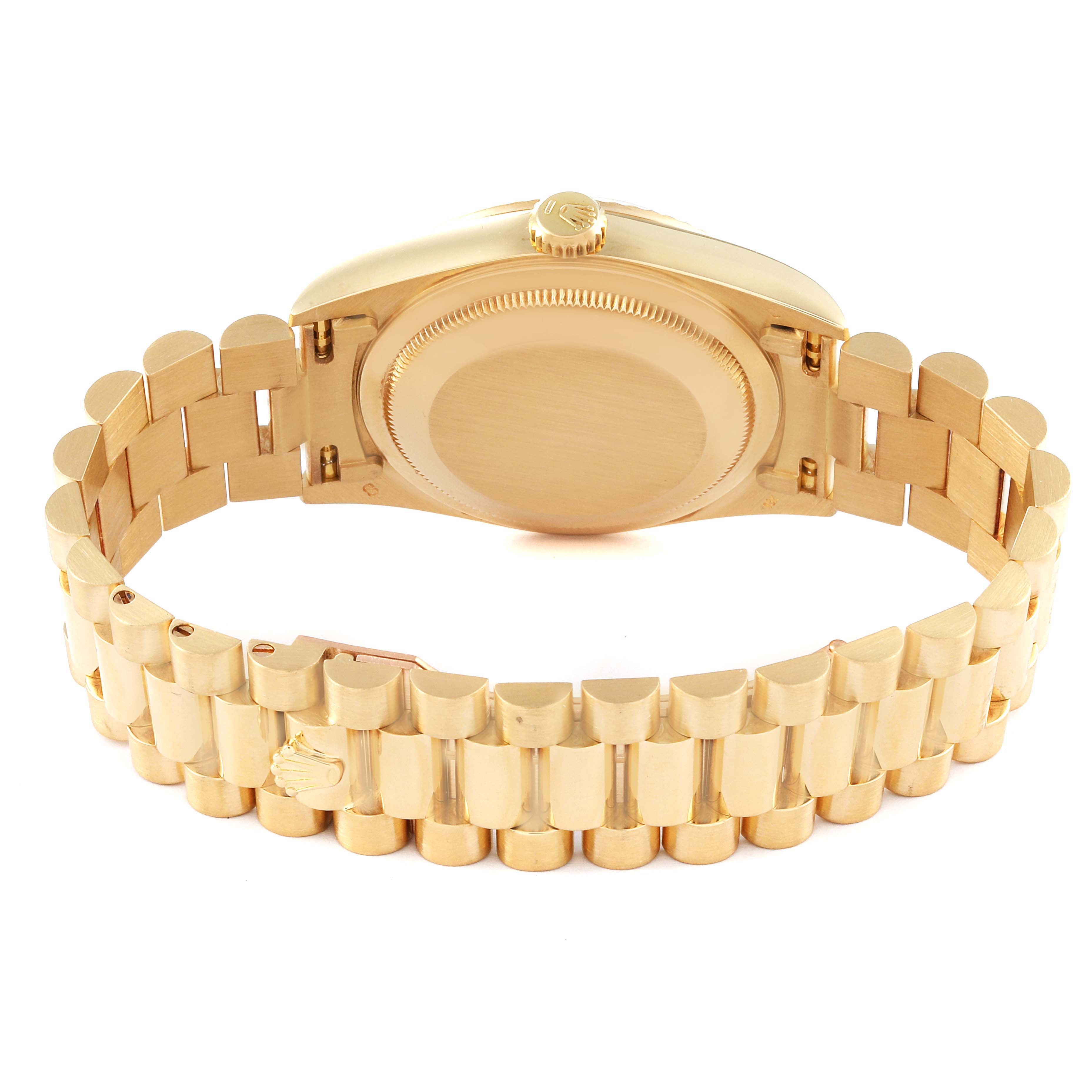 This image shows the backside and part of the bracelet of a Rolex President 18238 Men's Yellow Gold White Dial 18238 Men's Yellow Gold White Dial model watch.