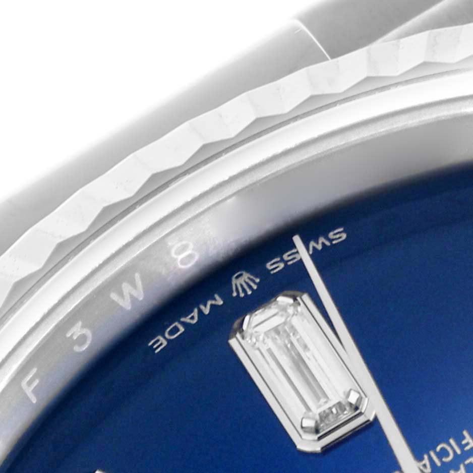 The image shows a close-up of the dial and engraved bezel of the Rolex President 128239 Men
s White Gold Blue Dial 128239 Men
s White Gold Blue Dial model.