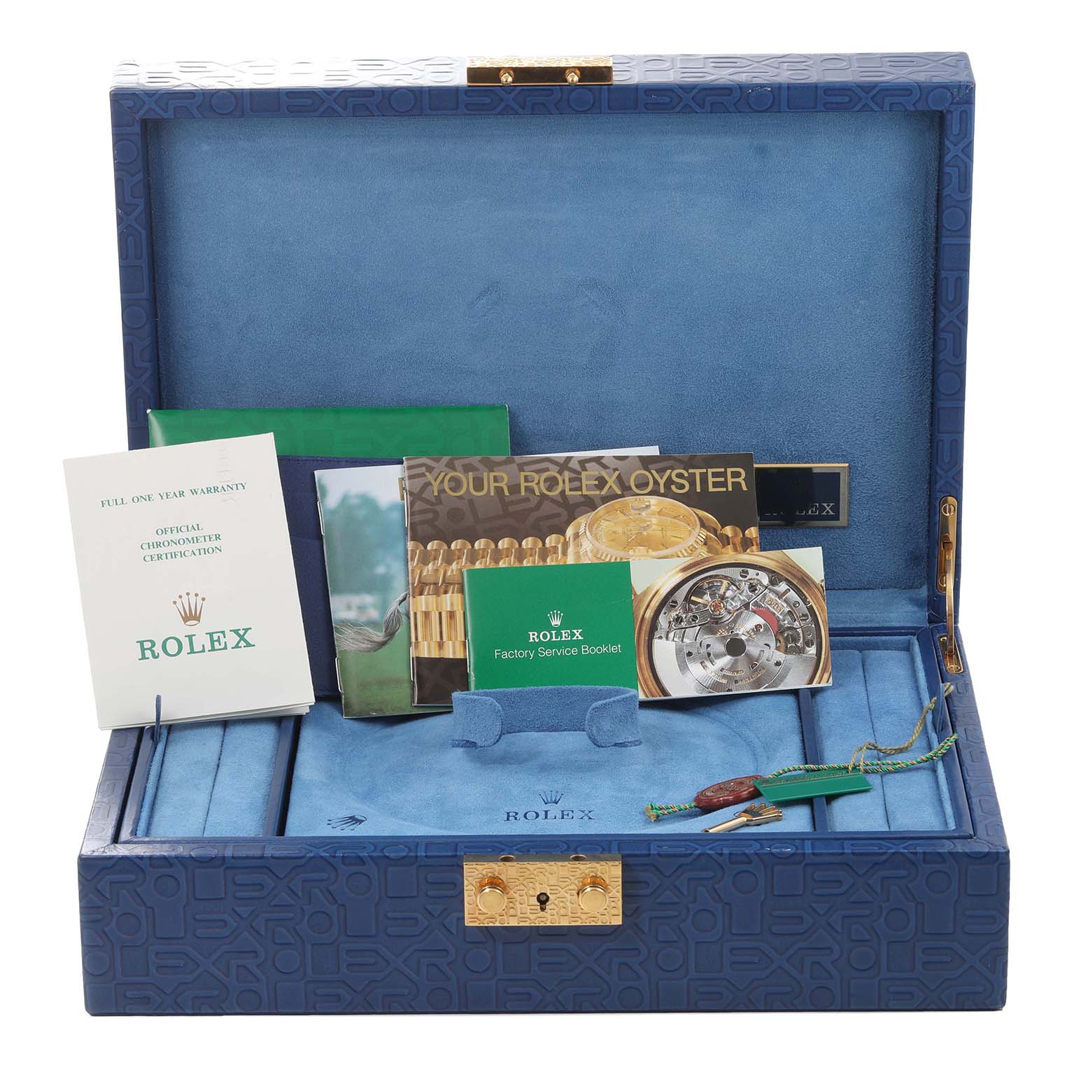 This image shows the open box and accessories, including booklets and tags, for a Rolex President 69138 Women's Yellow Gold Mother of Pearl Dial 69138 Women's Yellow Gold Mother of Pearl Dial model watch.