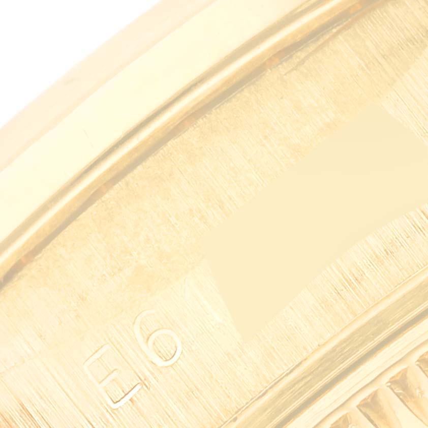 This image shows a close-up angle of the case back edge of a Rolex President 69138 Women's Yellow Gold Mother of Pearl Dial 69138 Women's Yellow Gold Mother of Pearl Dial model watch.