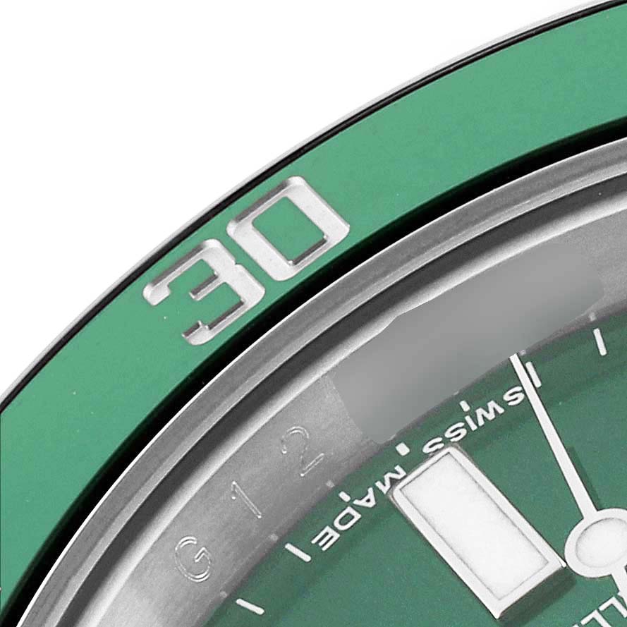 This close-up image shows the bezel and part of the dial of a Rolex Submariner 116610LV Men's Stainless Steel Green Dial 116610LV Men's Stainless Steel Green Dial watch.