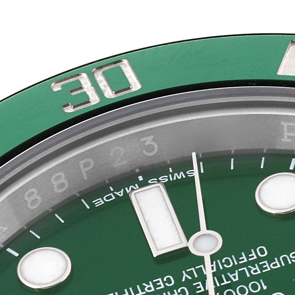 The image shows a close-up angle of the bezel, minute and hour markers, and part of the dial of a Rolex Submariner 116610LV Men's Stainless Steel Green Dial 116610LV Men's Stainless Steel Green Dial watch.