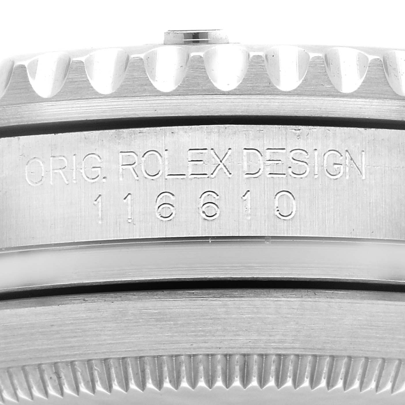 This image shows a close-up of the side inscription and grooved bezel of a Rolex Submariner 116610LV Men's Stainless Steel Green Dial 116610LV Men's Stainless Steel Green Dial, model number 116610.