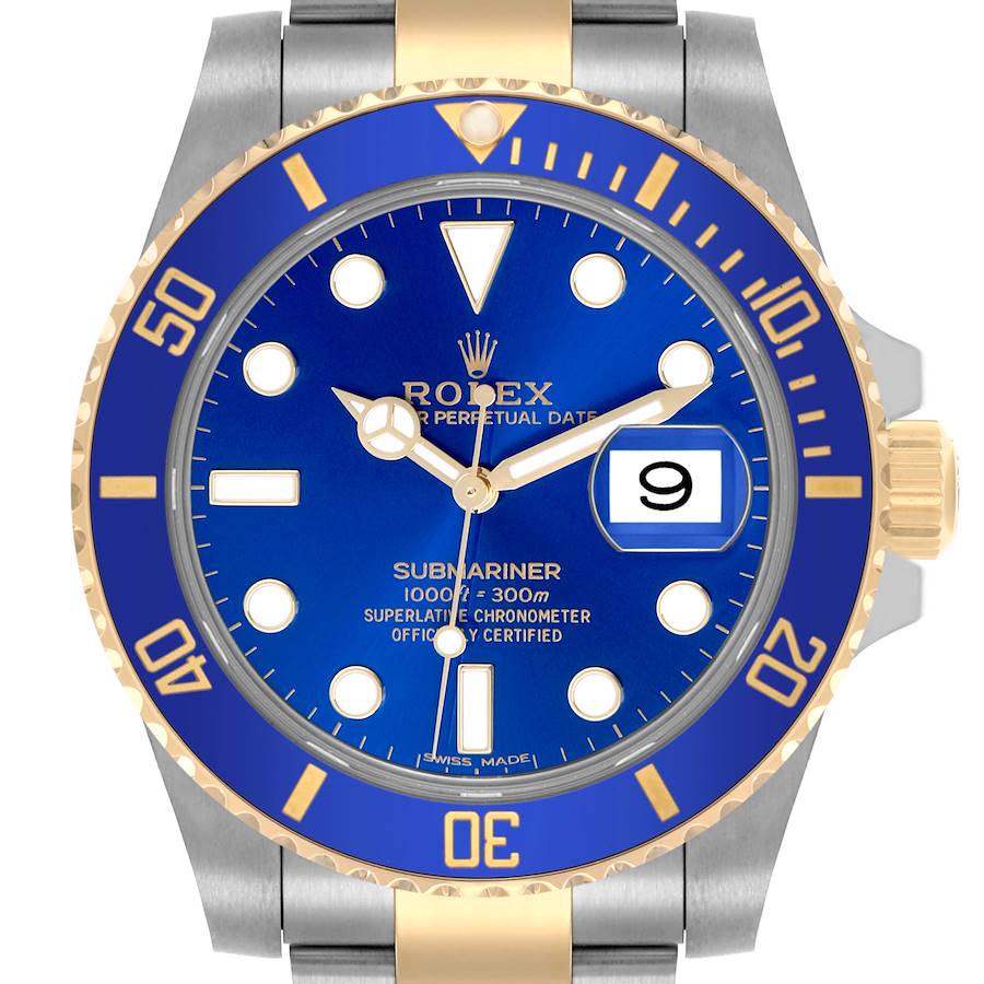 The image shows a frontal view of the Rolex Submariner, highlighting its blue dial, gold bezel, and stainless steel bracelet.