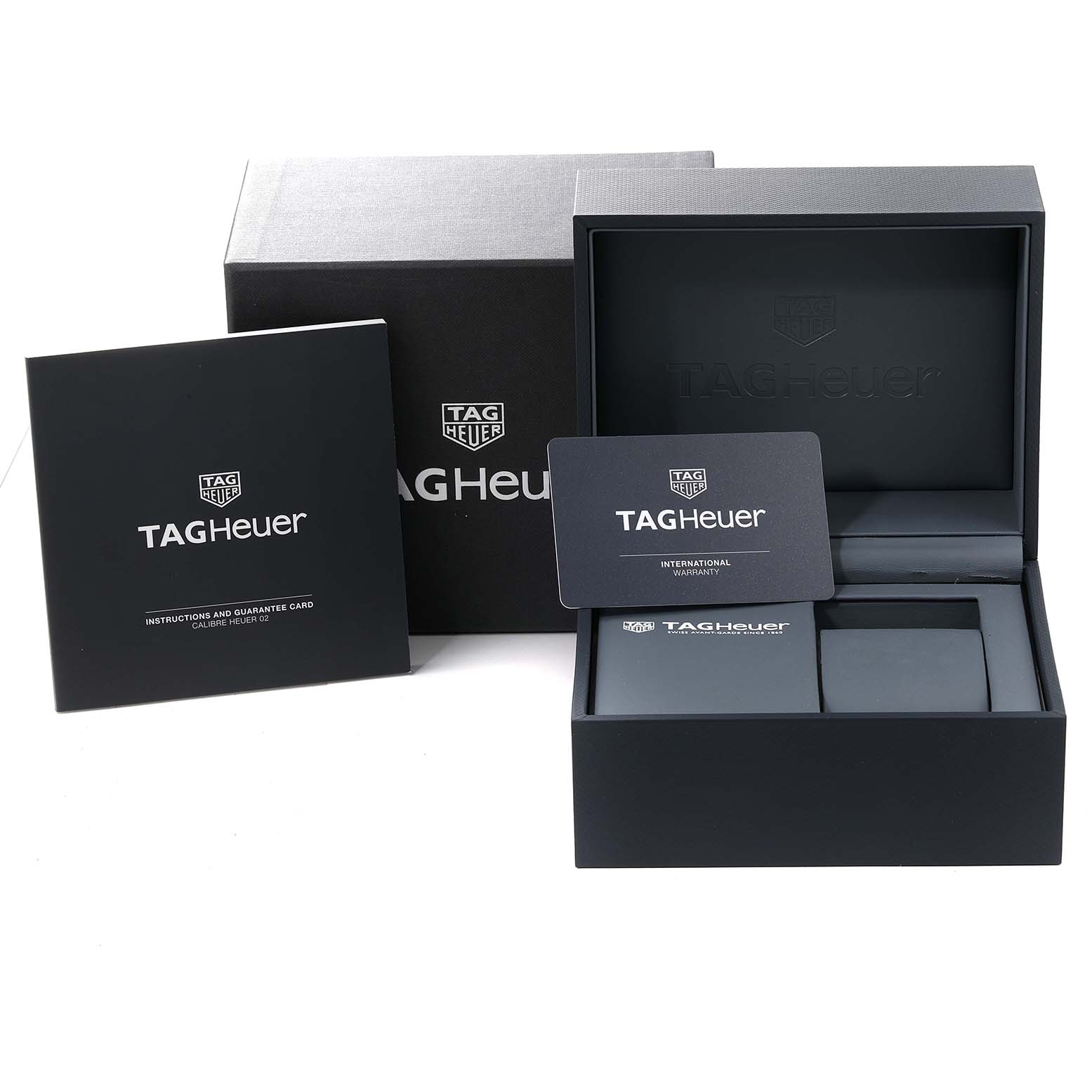 The image shows the box, warranty card, and instruction manual for a Tag Heuer Carrera CBG2010.FT6144 Men's Stainless Steel Black Dial CBG2010.FT6144 Men's Stainless Steel Black Dial watch.