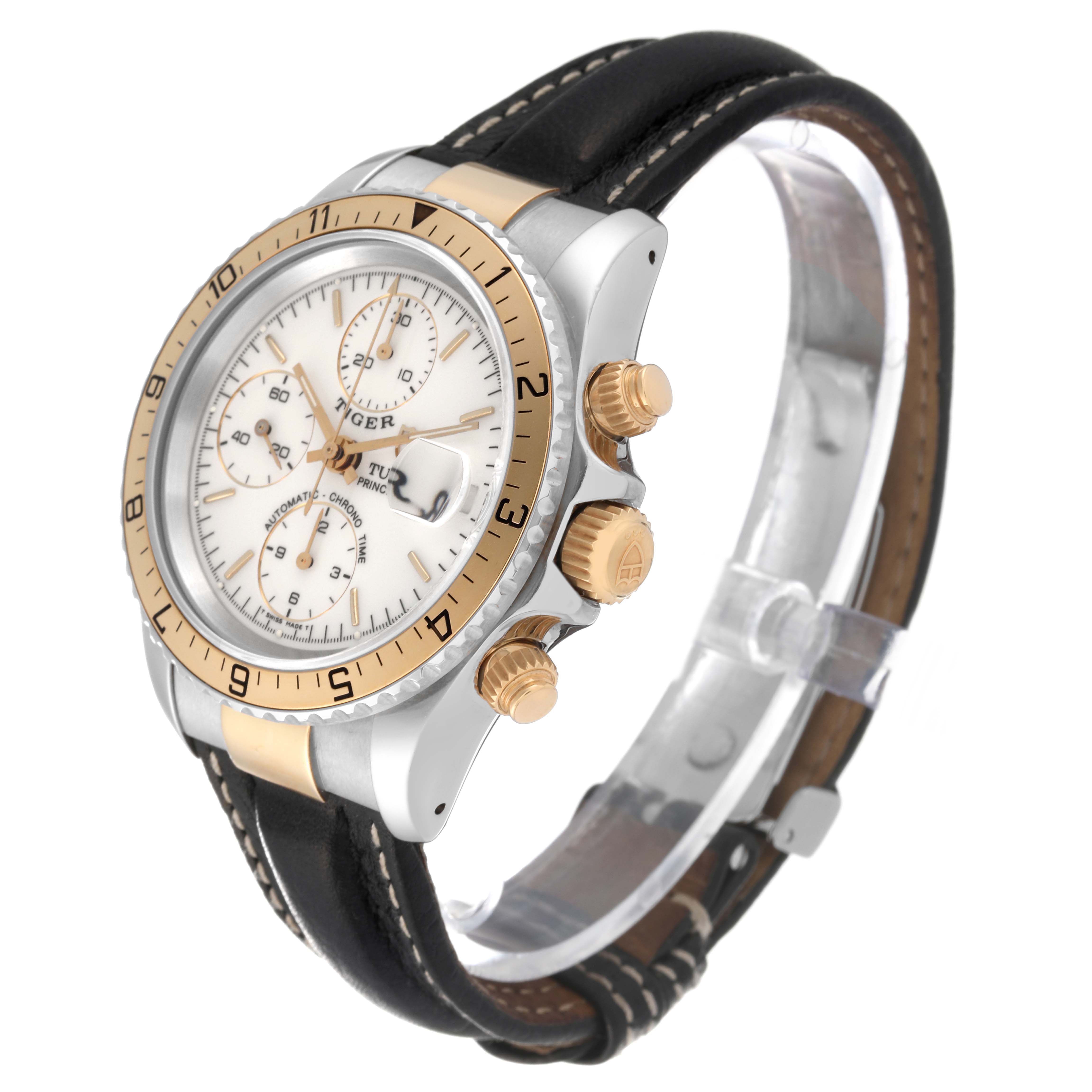 The Tudor Tiger 79273P Men's Steel and Gold (two tone) White Dial 79273P Men's Steel and Gold (two tone) White Dial watch is shown at an oblique angle, featuring the bezel, crown, pushers, dial, and leather strap.