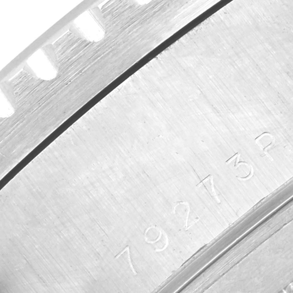 This close-up image shows part of the case back with engraved numbers from the Tudor Tiger 79273P Men's Steel and Gold (two tone) White Dial 79273P Men's Steel and Gold (two tone) White Dial model watch.