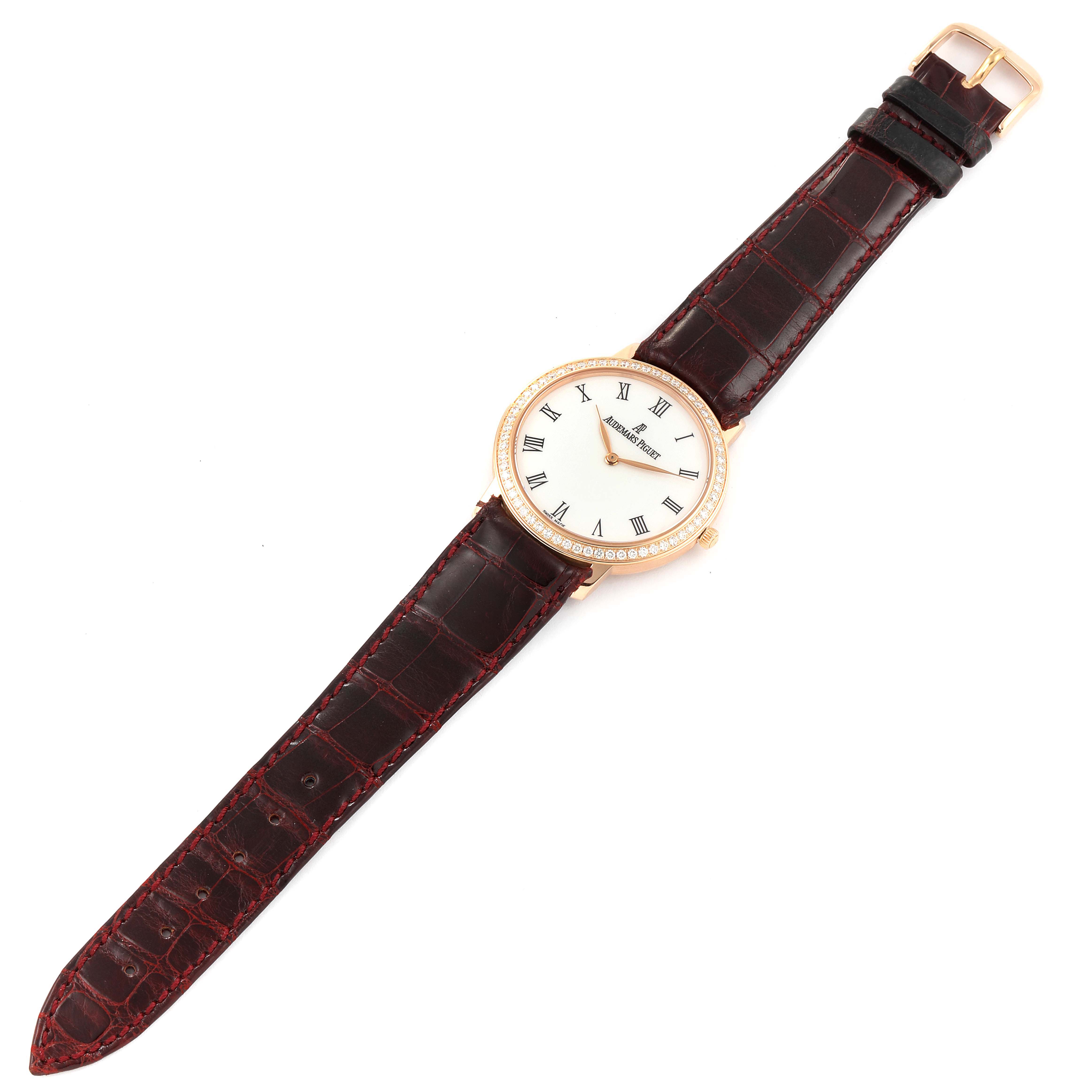 This image shows the Jules watch by Audemars Piguet from a top-down angle, including the face, strap, and buckle.