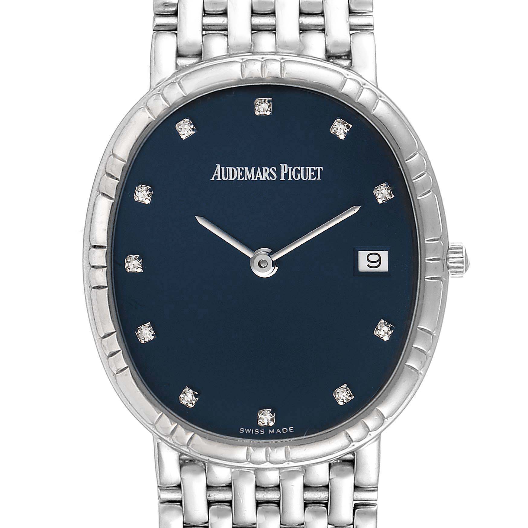This image shows a front view of a Vintage Audemars Piguet watch, highlighting its blue dial, silver hands, date window, and metal bracelet.
