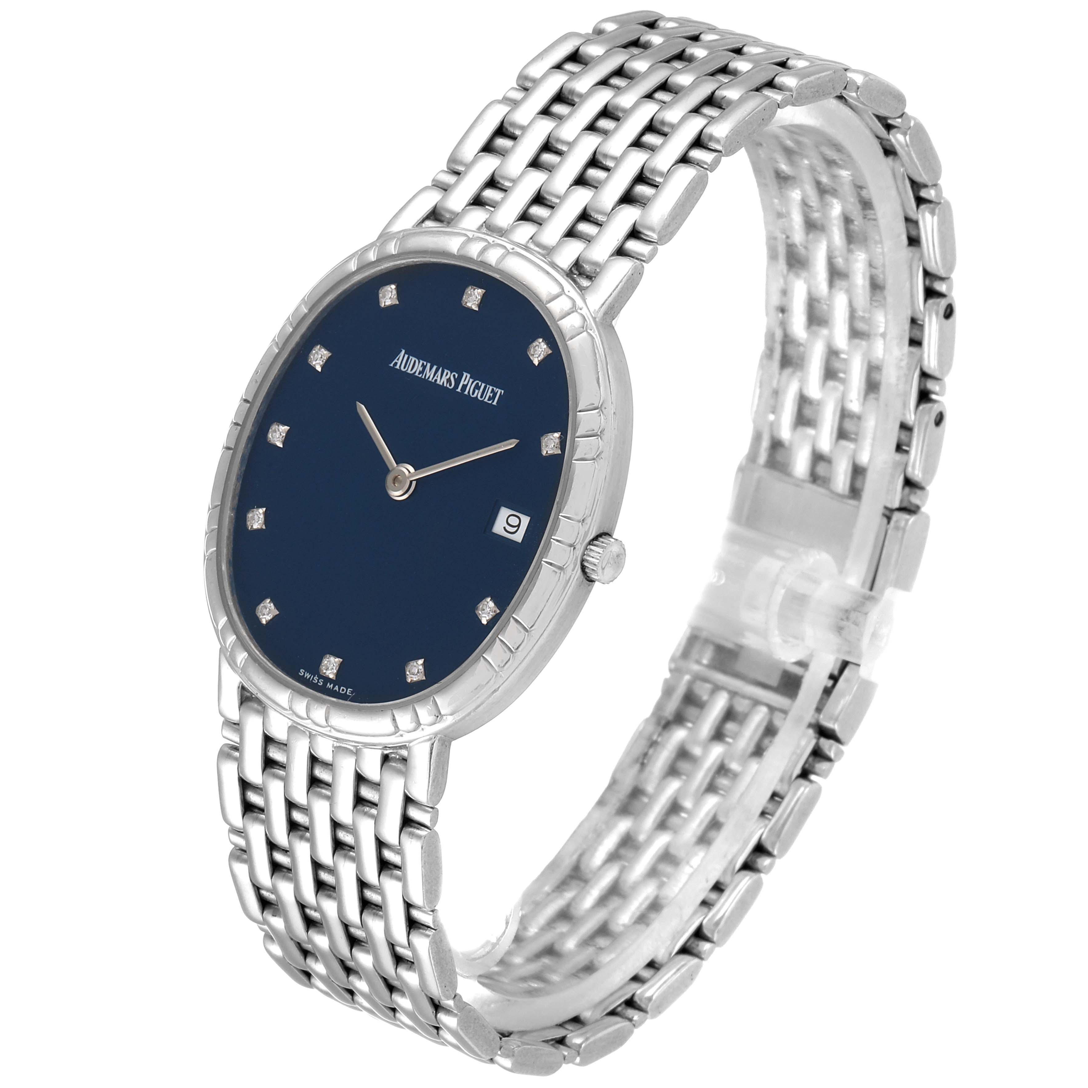 The image shows a Vintage Audemars Piguet watch at a three-quarter angle, highlighting its blue dial, silver bracelet, and diamond hour markers.