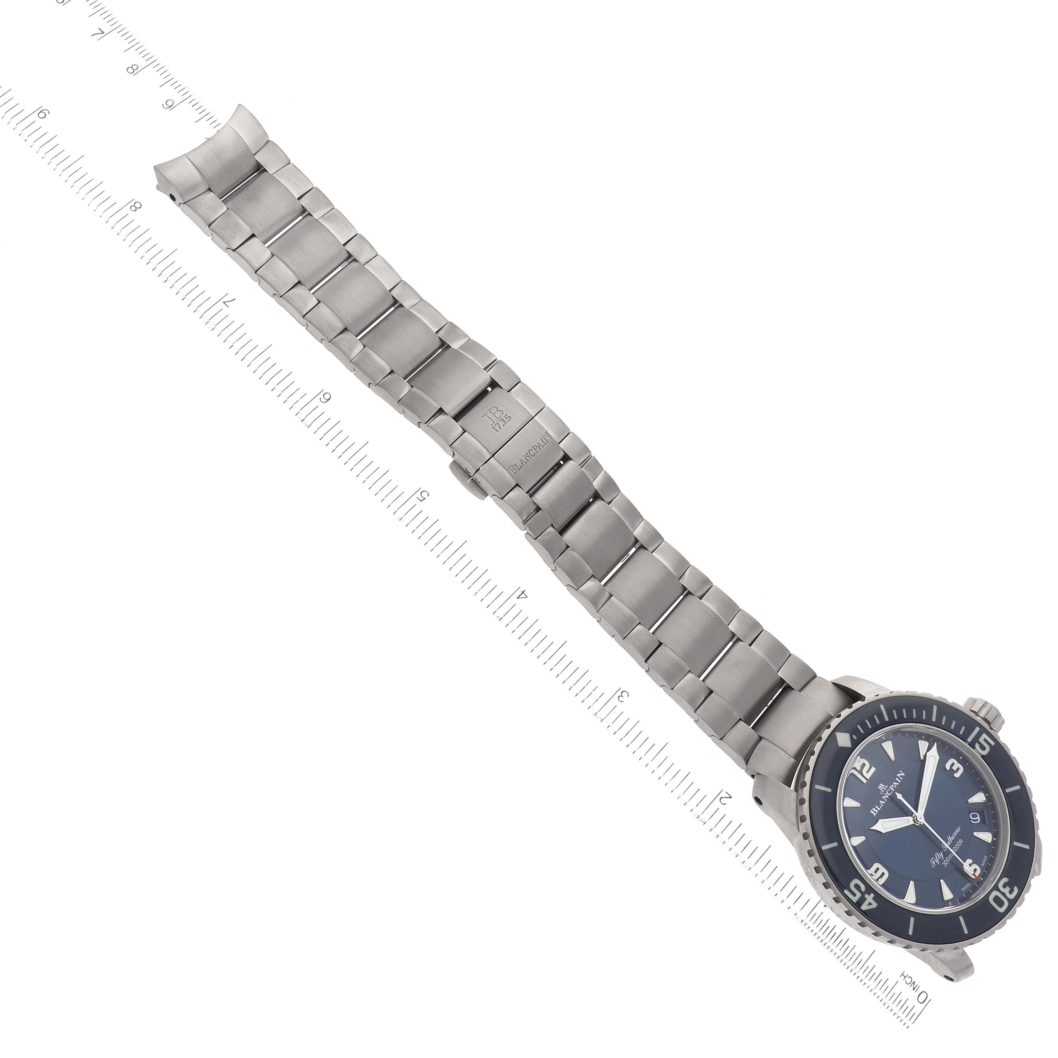 The image shows a Blancpain Fifty Fathoms 5015-12B40-052A Men's Titanium Blue Dial 5015-12B40-052A Men's Titanium Blue Dial watch at an overhead angle, highlighting the dial, bezel, and metal bracelet with a clasp.