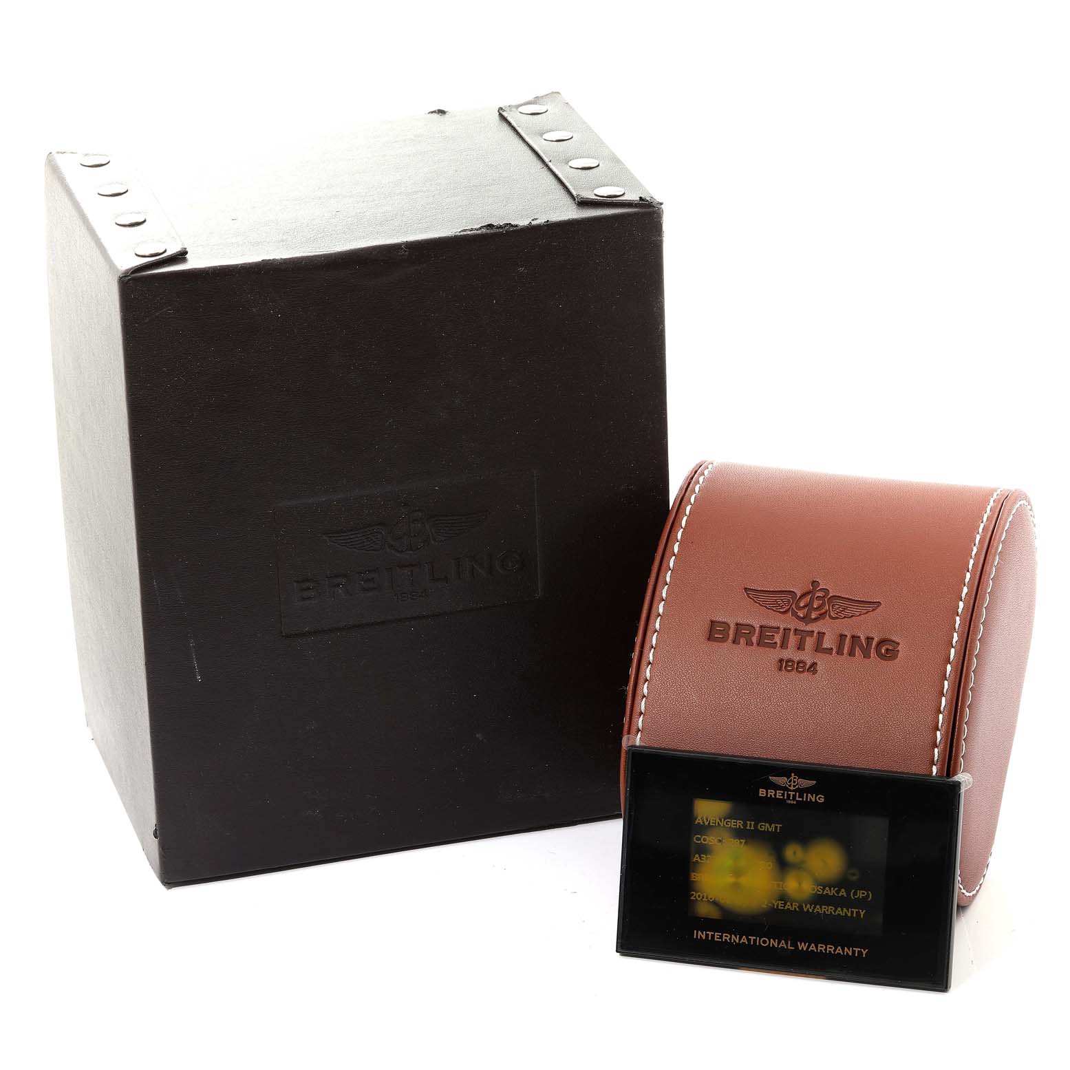 The image shows the Breitling Avenger A32390 Men's Stainless Steel Mother of Pearl Dial A32390 Men's Stainless Steel Mother of Pearl Dial watch packaging, including a brown leather case, a black box, and an international warranty card.