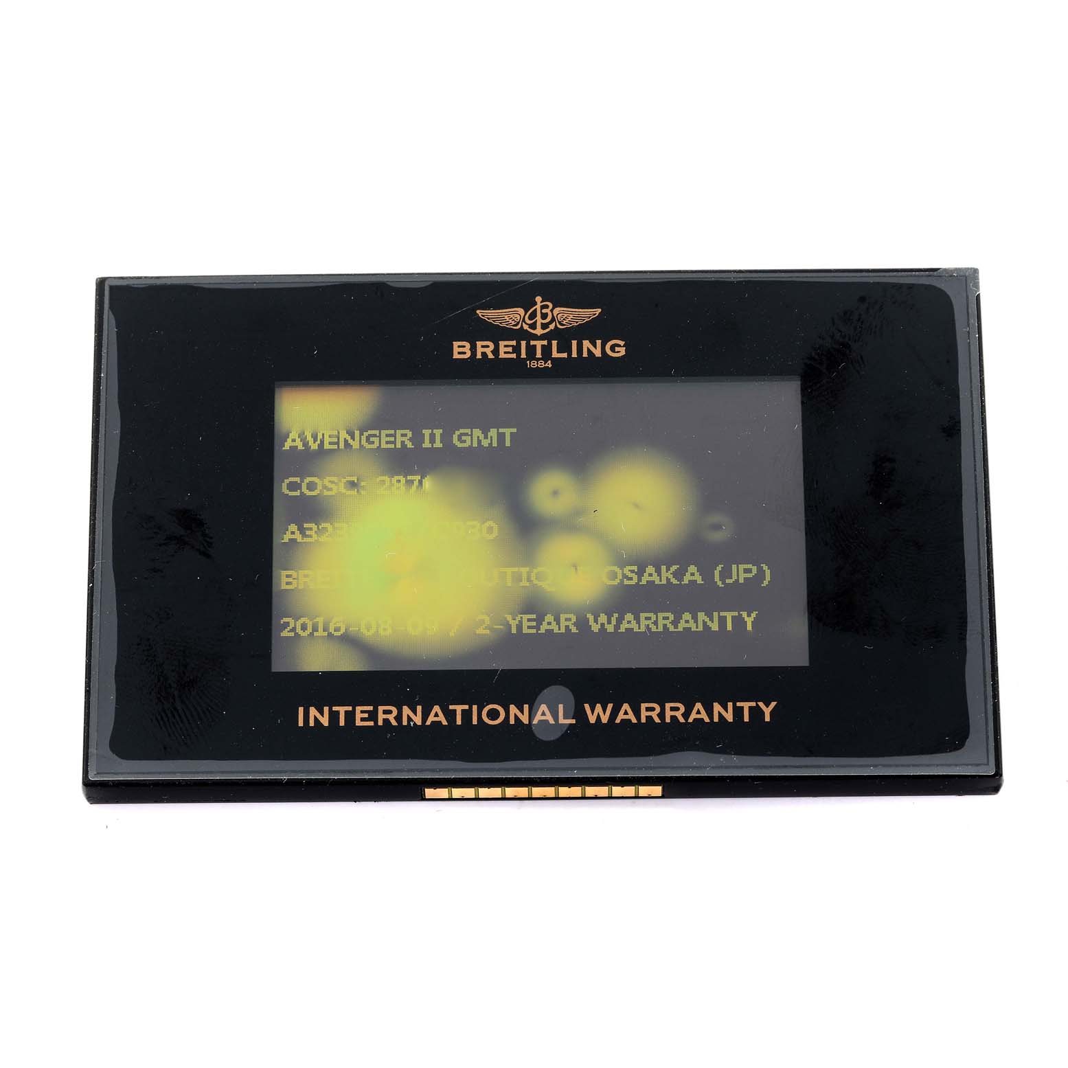 The image shows the international warranty card for the Breitling Avenger A32390 Men's Stainless Steel Mother of Pearl Dial A32390 Men's Stainless Steel Mother of Pearl Dial II GMT watch, viewed from the front.