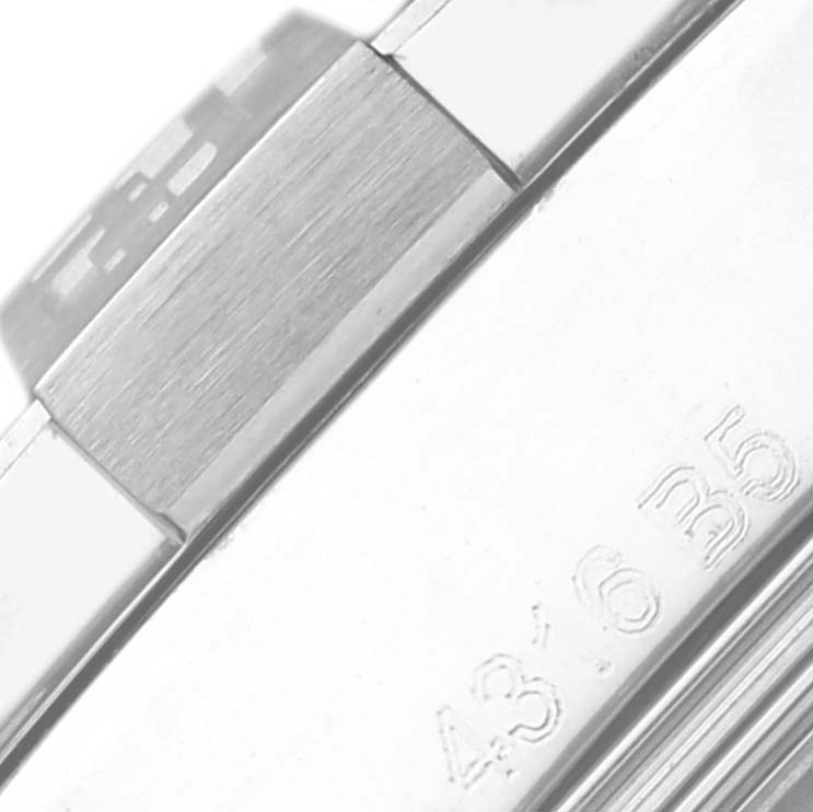 The image shows a close-up of the side of a Breitling Avenger A3239011/C930 Men's Stainless Steel Mother of Pearl Dial A3239011/C930 Men's Stainless Steel Mother of Pearl Dial watch, highlighting the brushed metal bracelet and engraved details.