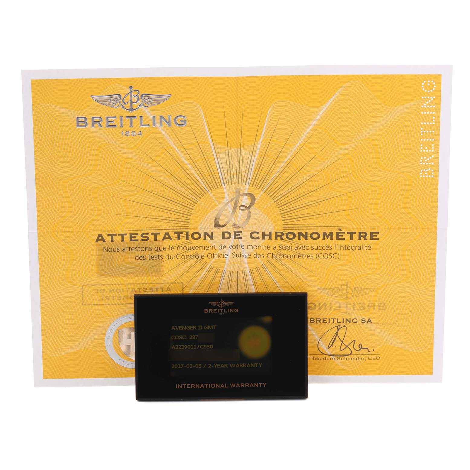 The image shows a Breitling Avenger A3239011/C930 Men's Stainless Steel Mother of Pearl Dial A3239011/C930 Men's Stainless Steel Mother of Pearl Dial model international warranty card and a chronometer certificate, laid flat.