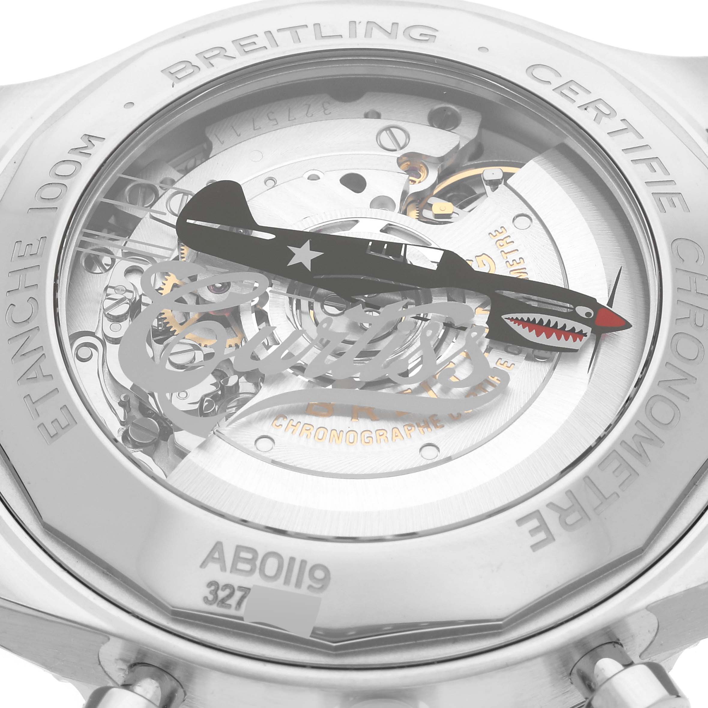 The image shows the back view of a Breitling Navitimer watch, highlighting its inner mechanisms and engraved text.