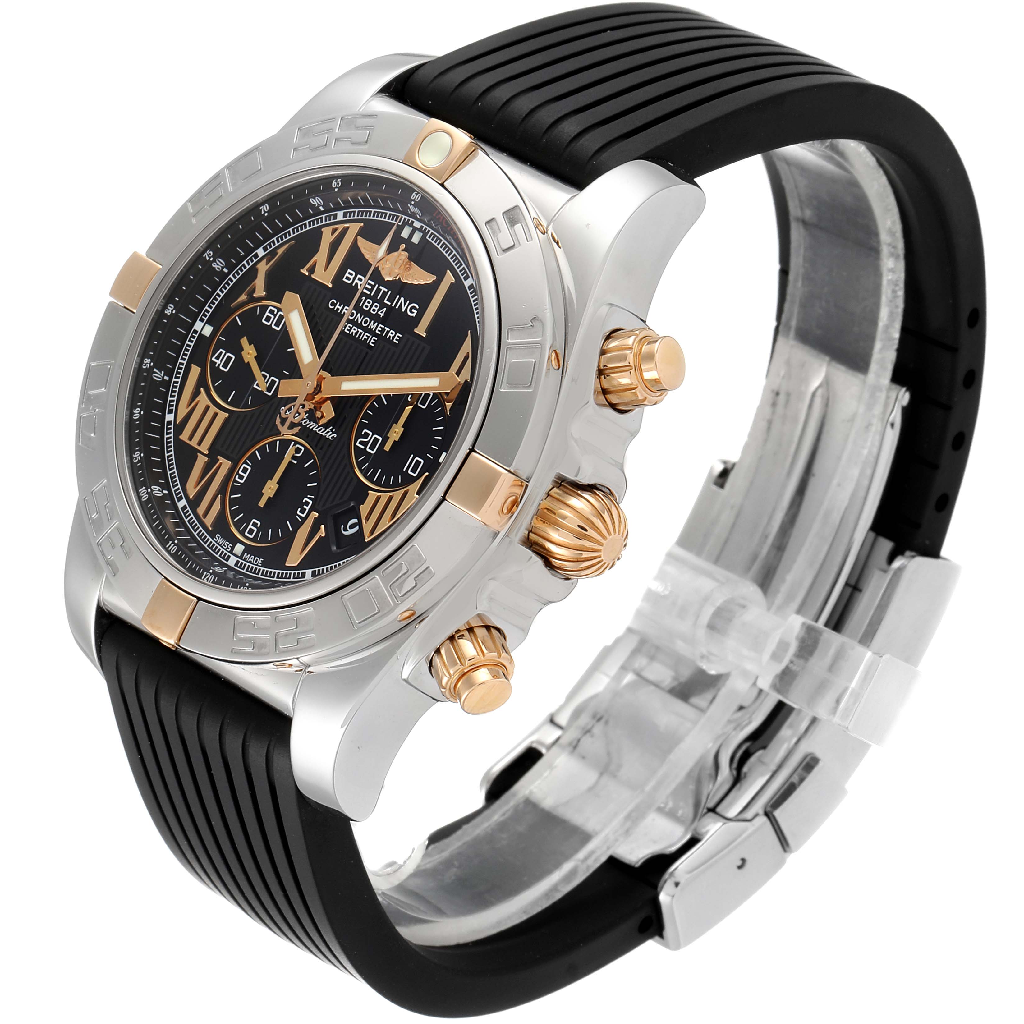 The Breitling Chronomat 1B0110 Men's Steel and Gold (two tone) Black Dial 1B0110 Men's Steel and Gold (two tone) Black Dial watch is shown from a three-quarter angle, highlighting its dial, chronograph buttons, and rubber strap.