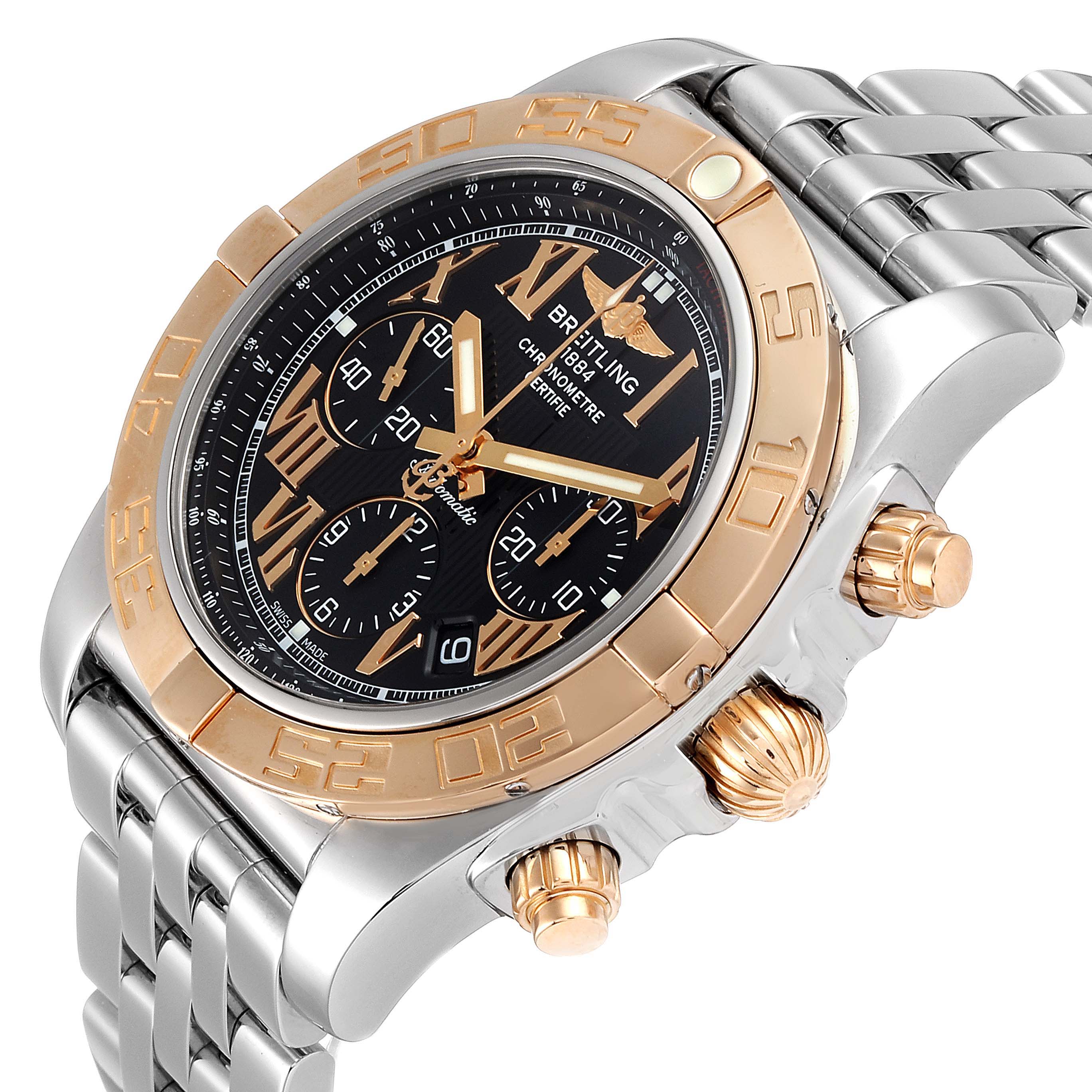 This Breitling Chronomat CB011012 Men's Steel and Gold (two tone) Black Dial CB011012 Men's Steel and Gold (two tone) Black Dial watch is shown from an angled view, highlighting the crown, pushers, bezel, and partial bracelet.