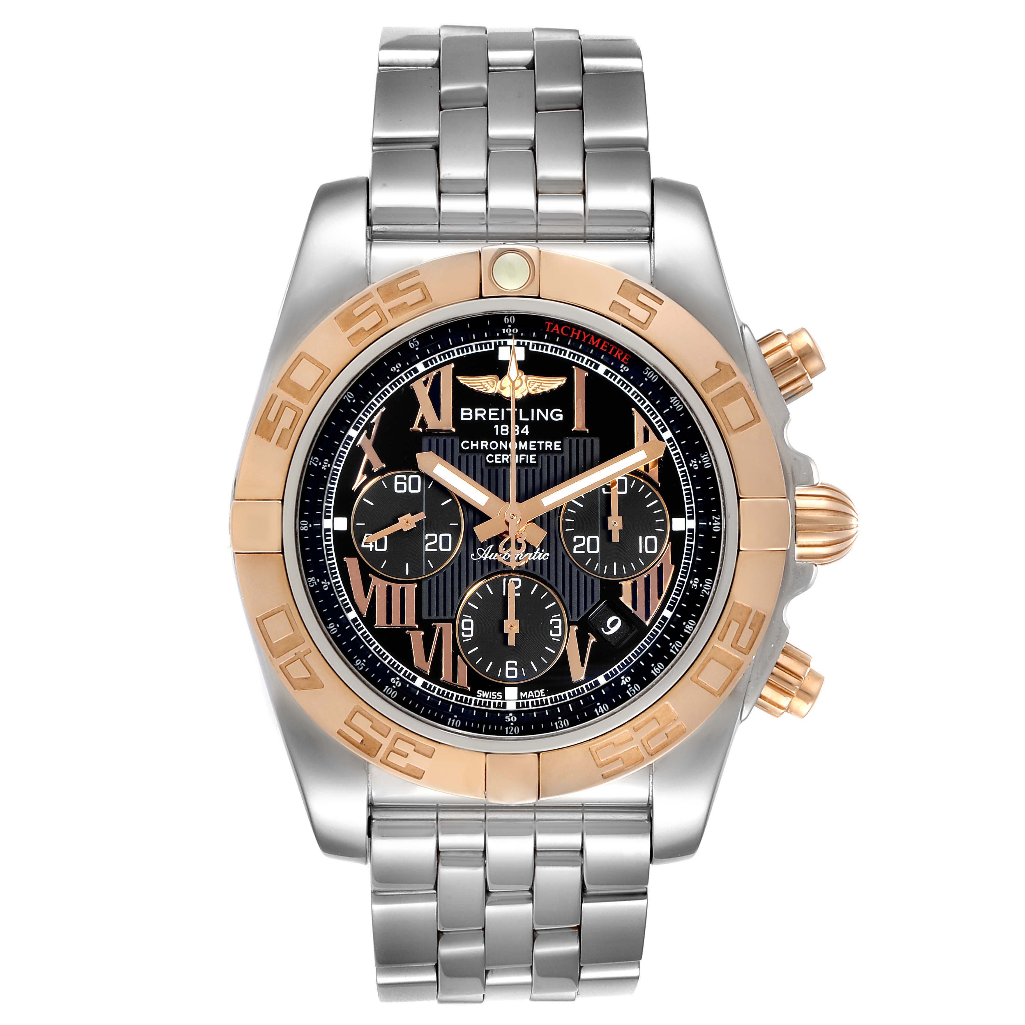 The image shows a Breitling Chronomat CB011012 Men's Steel and Gold (two tone) Black Dial CB011012 Men's Steel and Gold (two tone) Black Dial watch from a front angle, featuring its face, bezel, buttons, and metal strap.