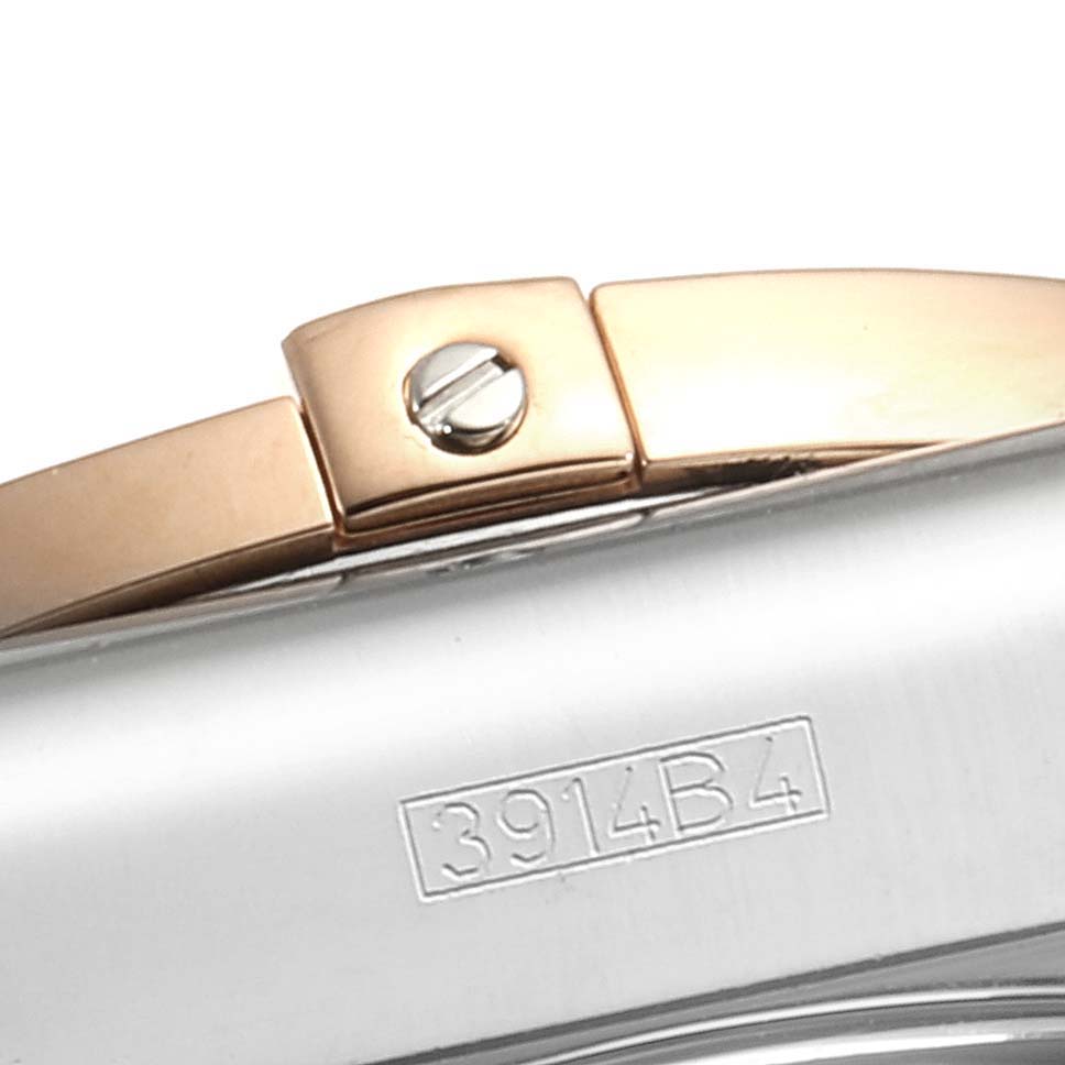 This image shows a close-up side view of the clasp and part of the bracelet of a Breitling Chronomat CB011012 Men's Steel and Gold (two tone) Black Dial CB011012 Men's Steel and Gold (two tone) Black Dial.