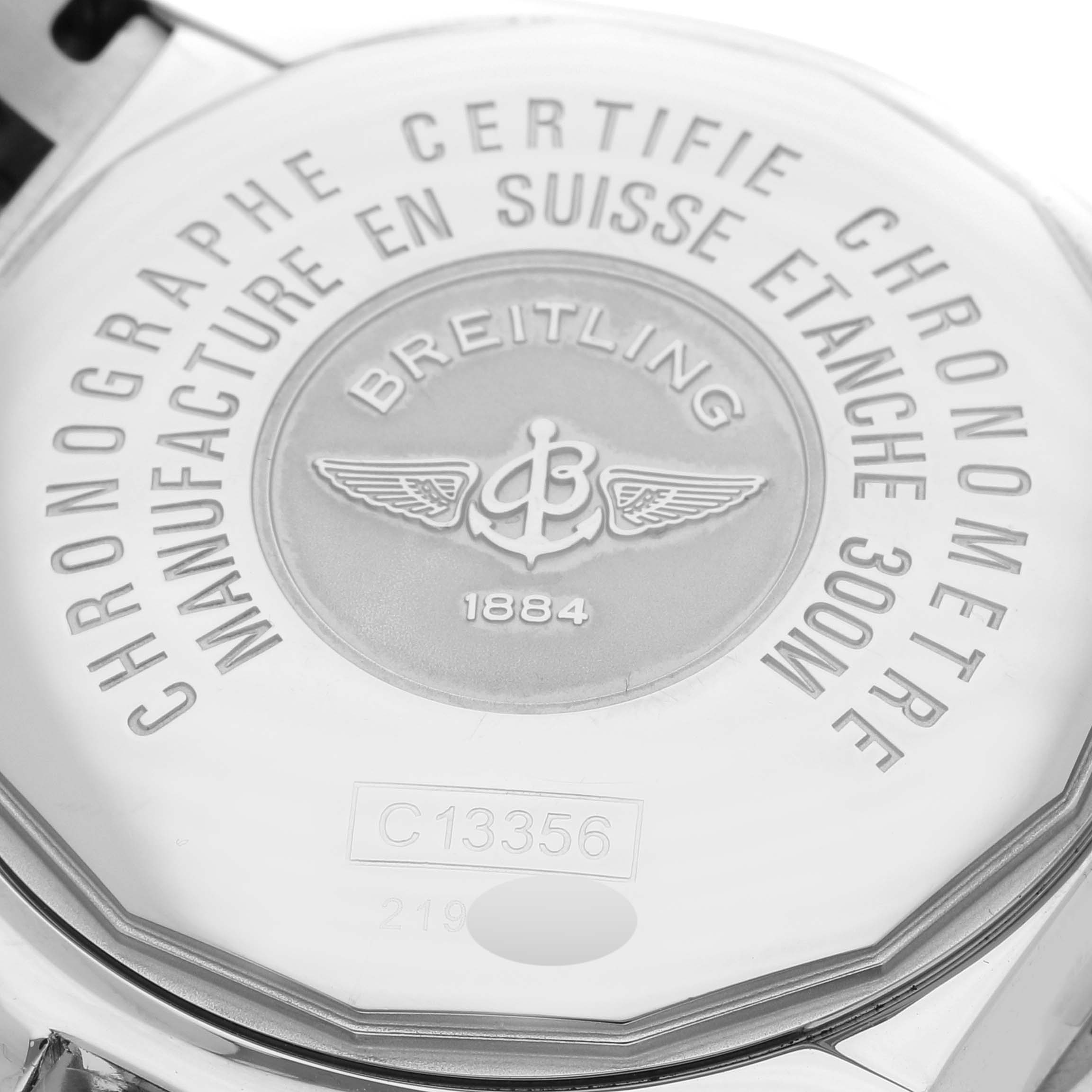 The image shows the back case of a Breitling Chronomat C13356 Men's Steel and Gold (two tone) Black Dial C13356 Men's Steel and Gold (two tone) Black Dial watch displaying the brand logo and model details.