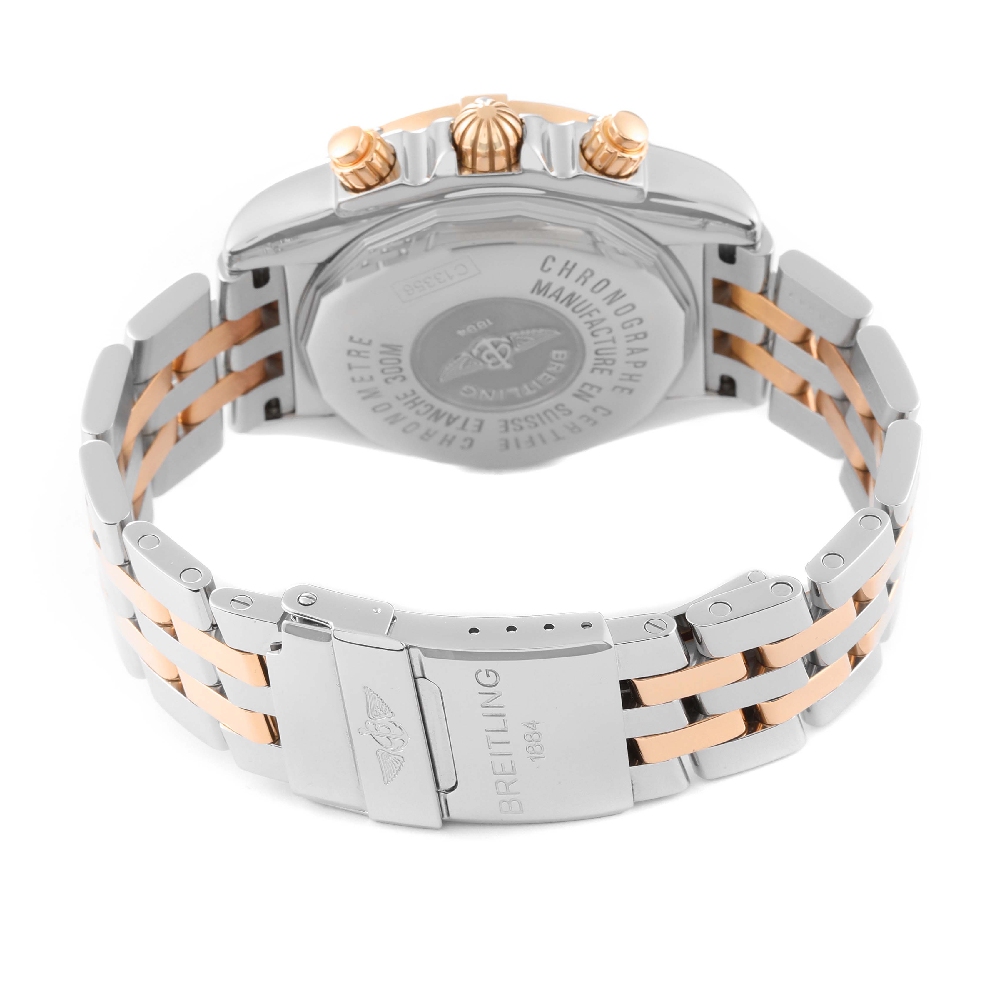 The image shows the back view and clasp of a Breitling Chronomat C13356 Men's Steel and Gold (two tone) Black Dial C13356 Men's Steel and Gold (two tone) Black Dial watch, highlighting its two-tone metal bracelet and case back.