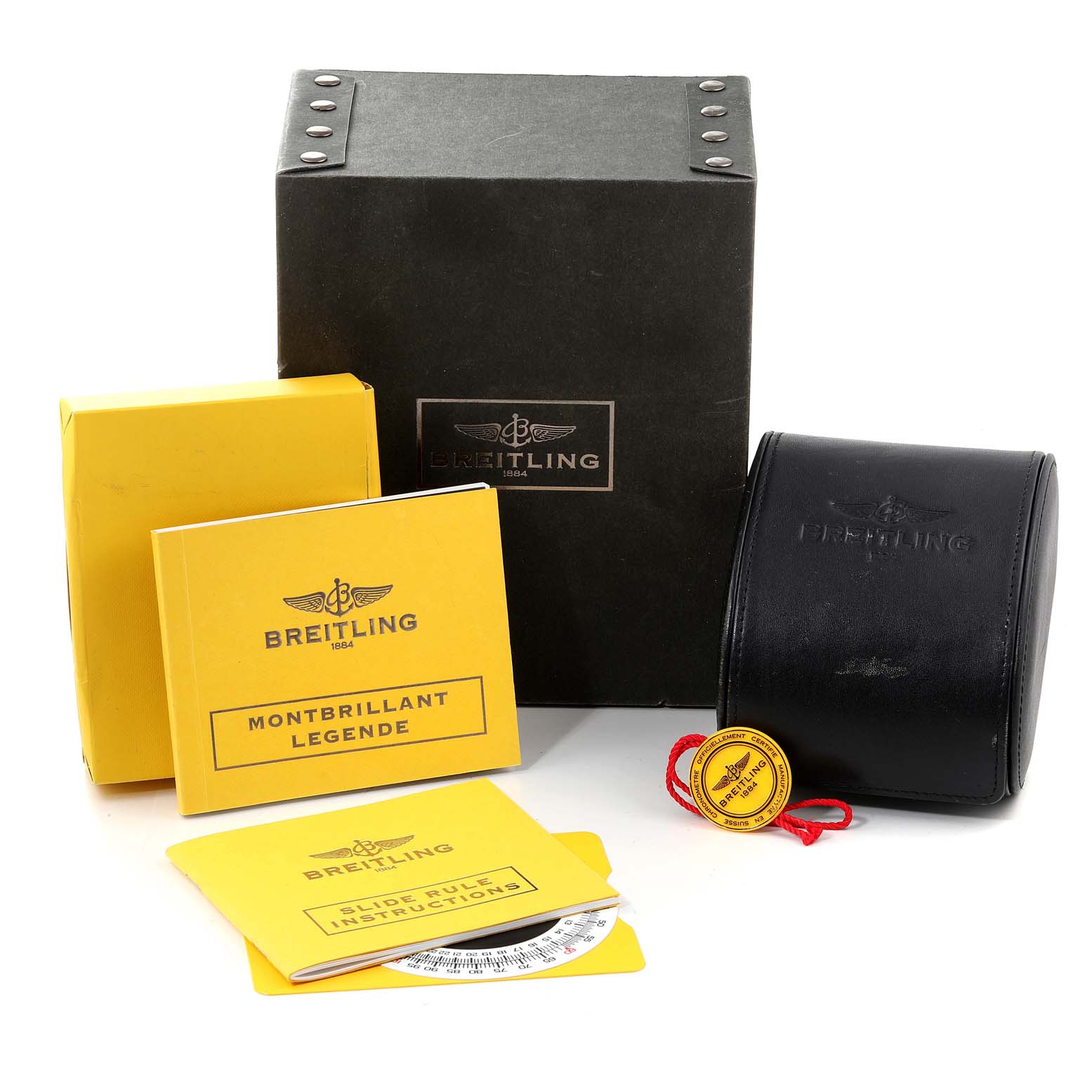 The image shows Breitling Navitimer C23340 Men's Steel and Gold (two tone) Brown Dial C23340 Men's Steel and Gold (two tone) Brown Dial accessories including boxes, manuals, a tag, and a black leather watch case.