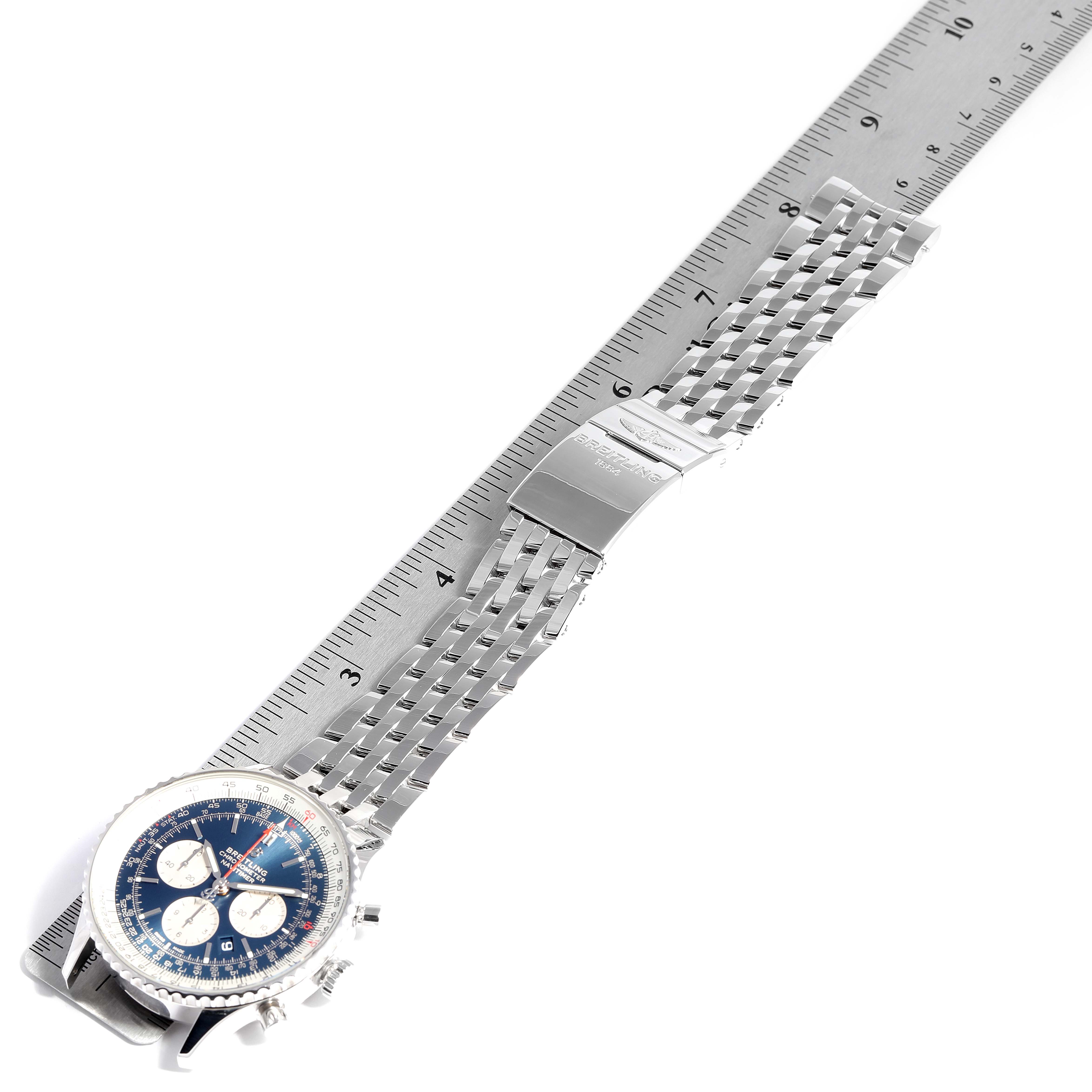 The image shows a Breitling Navitimer AB0127211C1A1 Men
s Stainless Steel Blue Dial AB0127211C1A1 Men
s Stainless Steel Blue Dial watch laid flat with the dial, bracelet, and clasp visible, alongside a ruler for size reference.