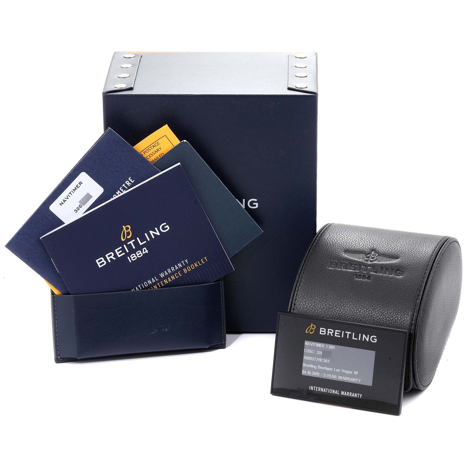 The image shows the packaging, warranty card, manual booklets, and a leather watch case for the Breitling Navitimer AB0127211C1A1 Men
s Stainless Steel Blue Dial AB0127211C1A1 Men
s Stainless Steel Blue Dial model.