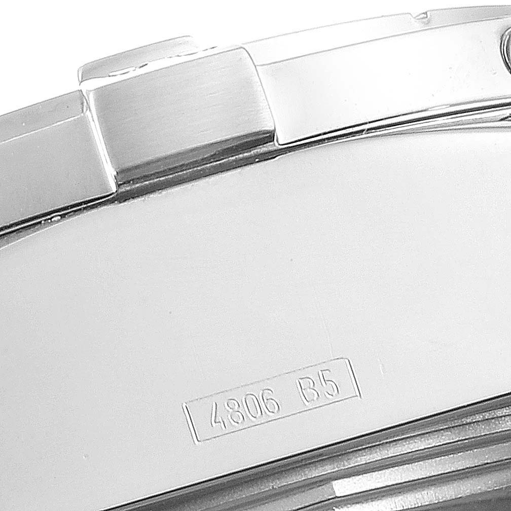 The image shows a close-up of the side and part of the back of a Breitling Avenger A13370 Men's Stainless Steel White Dial A13370 Men's Stainless Steel White Dial watch, including a segment of the bracelet and etched serial number.