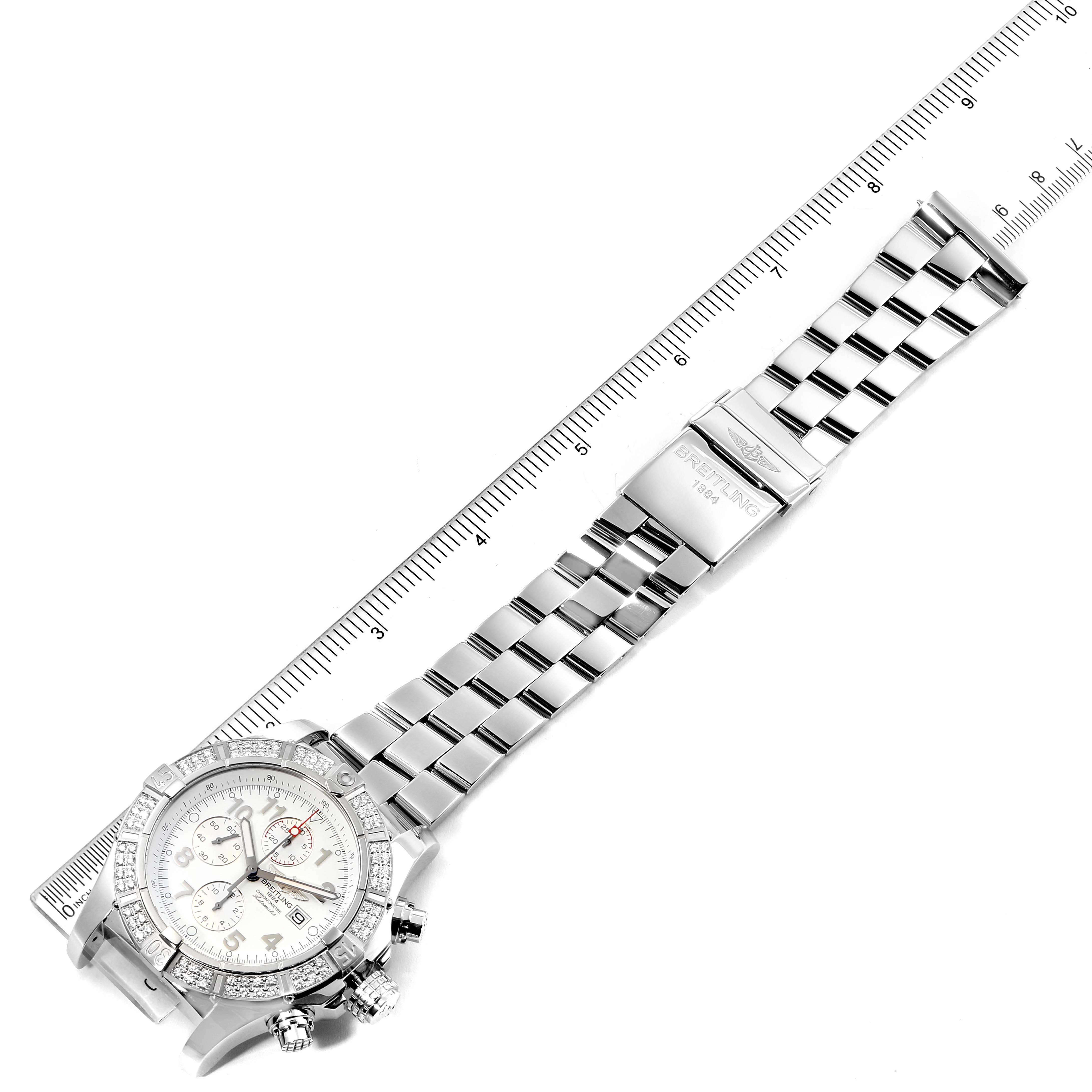 The image shows a top-down view of a Breitling Avenger A13370 Men's Stainless Steel White Dial A13370 Men's Stainless Steel White Dial watch, displaying the dial, bracelet, and clasp positioned along a ruler.