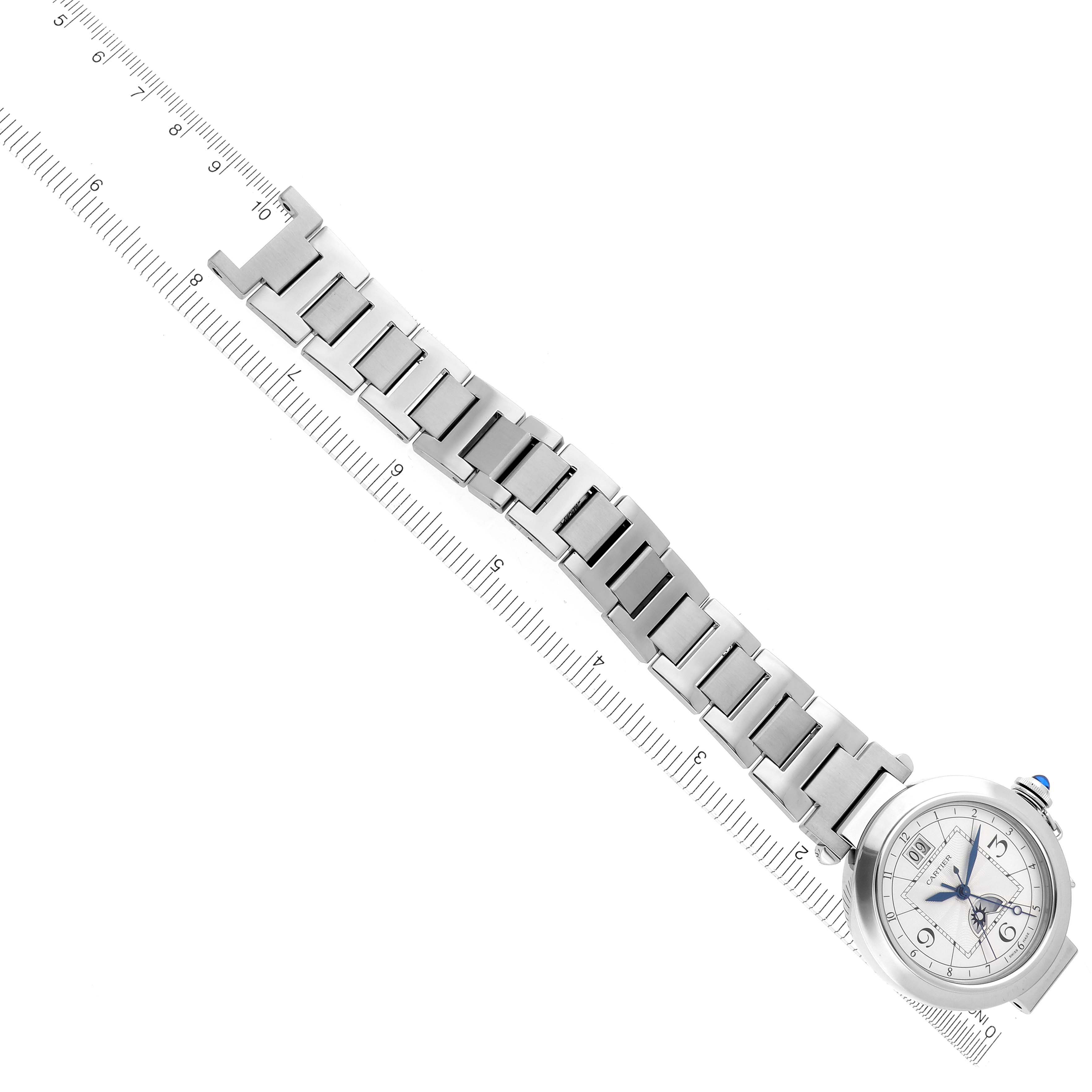 The Cartier Pasha W31093M7 Men's Stainless Steel Silver Dial W31093M7 Men's Stainless Steel Silver Dial watch is shown at an angle with its bracelet aligned along a ruler.