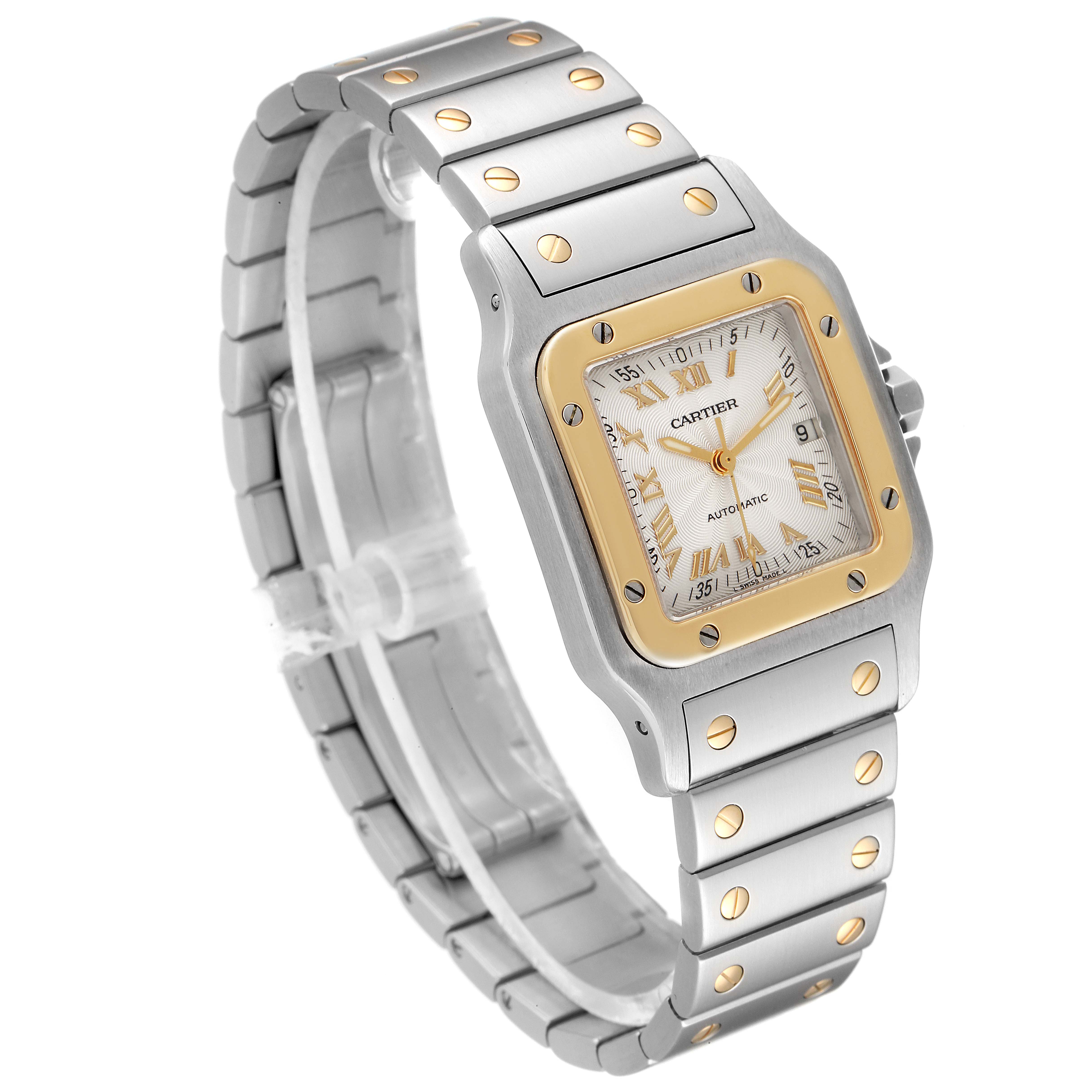 The image shows an angled view of a Cartier Santos W20058C4 Men's Steel and Gold (two tone) Silver Dial W20058C4 Men's Steel and Gold (two tone) Silver Dial watch, highlighting its face, bezel, and metal bracelet.