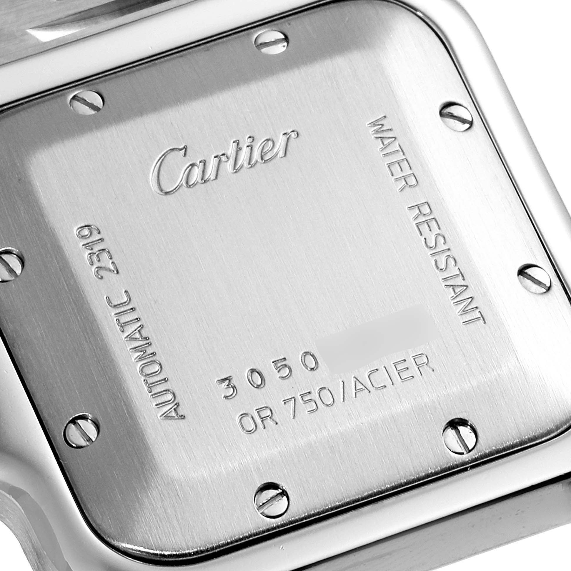 This image shows the back case of a Cartier Santos W20058C4 Men's Steel and Gold (two tone) Silver Dial W20058C4 Men's Steel and Gold (two tone) Silver Dial watch, highlighting its inscriptions and screws.